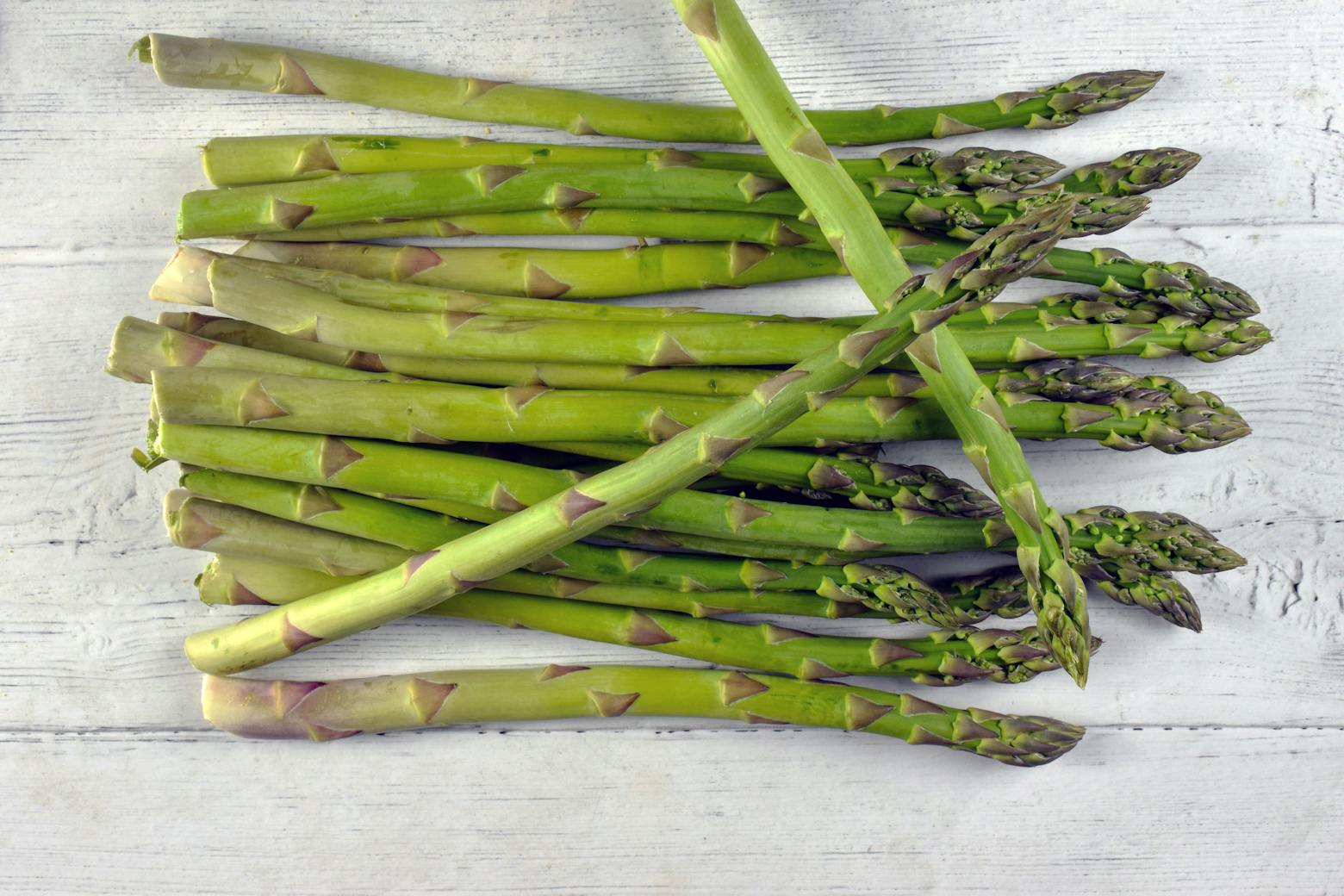 Fresh Asparagus on Wooden Surface.