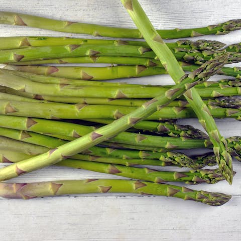 Fresh Asparagus on Wooden Surface.