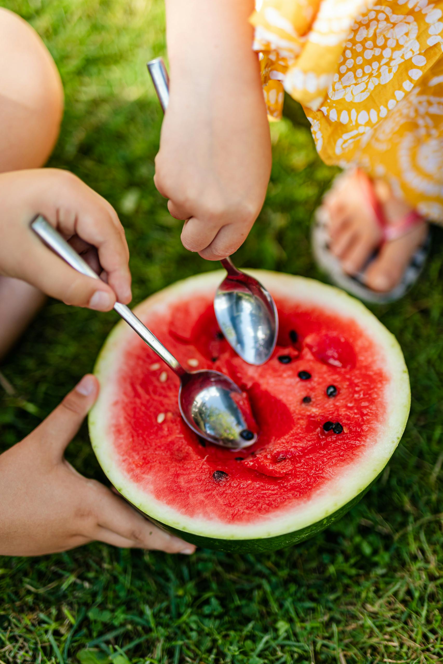 Kids Eating Watermelon with Spoons.