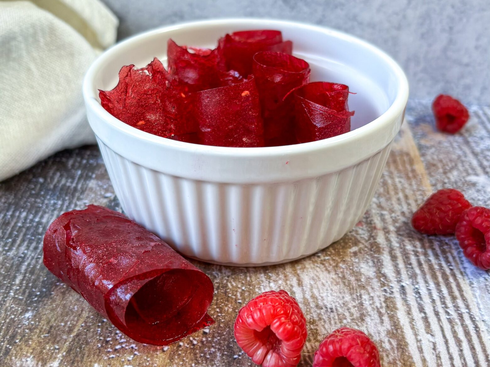 Raspberry-thyme fruit roll-ups in a bowl.