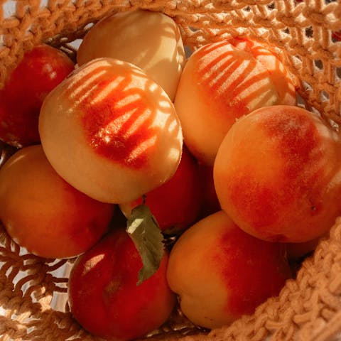 Fresh Peaches on Brown Woven Basket