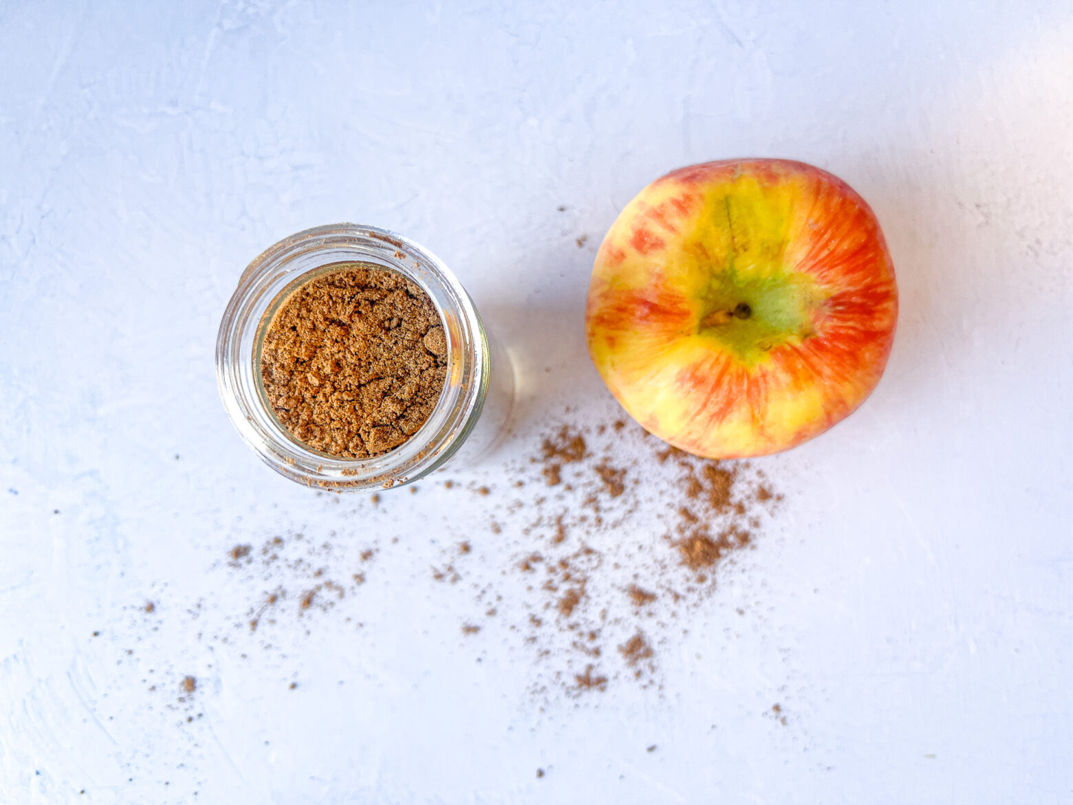 Finished apple pie spice above shot with an apple next to it.