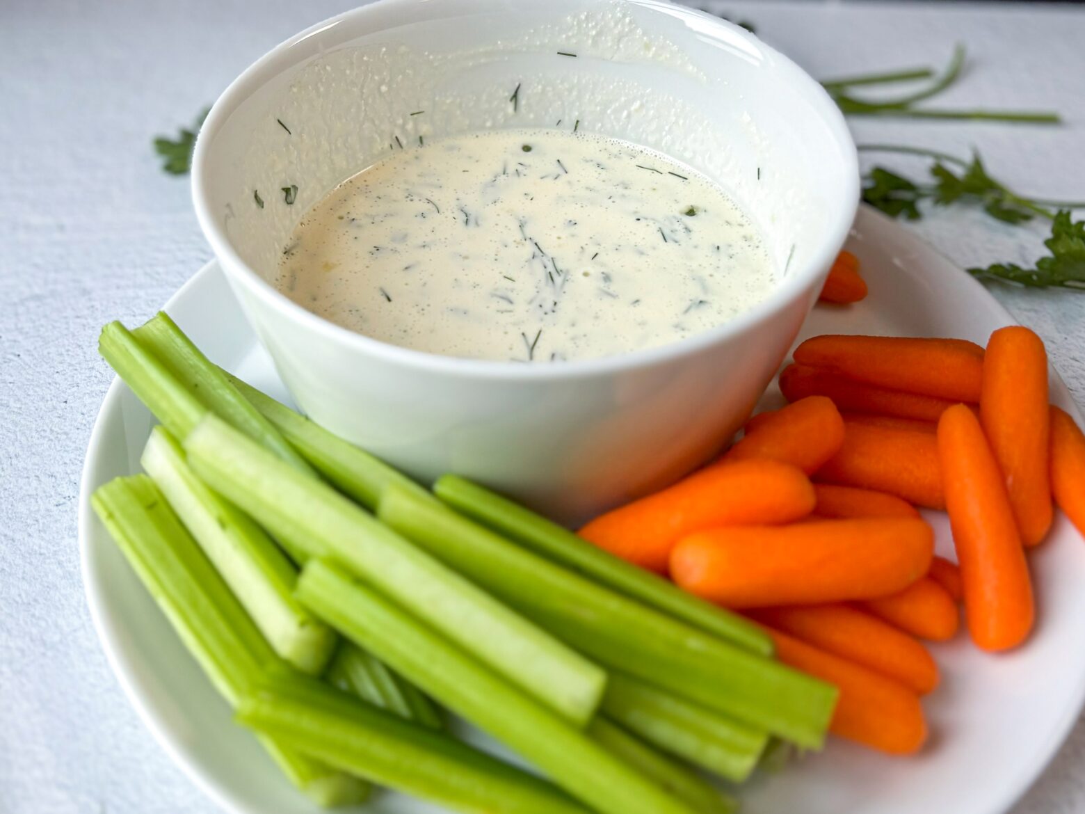Healthy ranch dressing with carrots and celery sticks