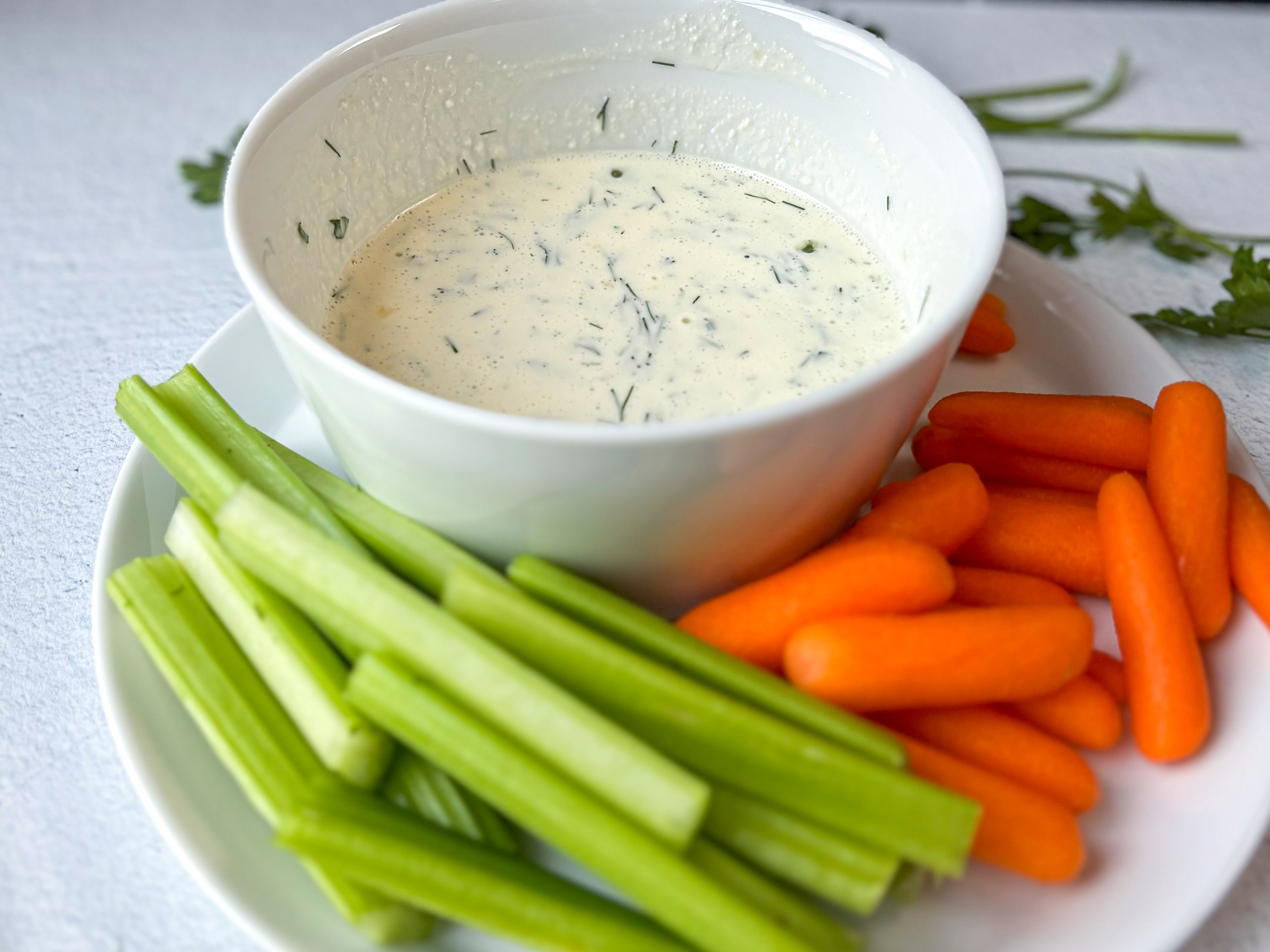 Healthy ranch dressing with carrots and celery sticks