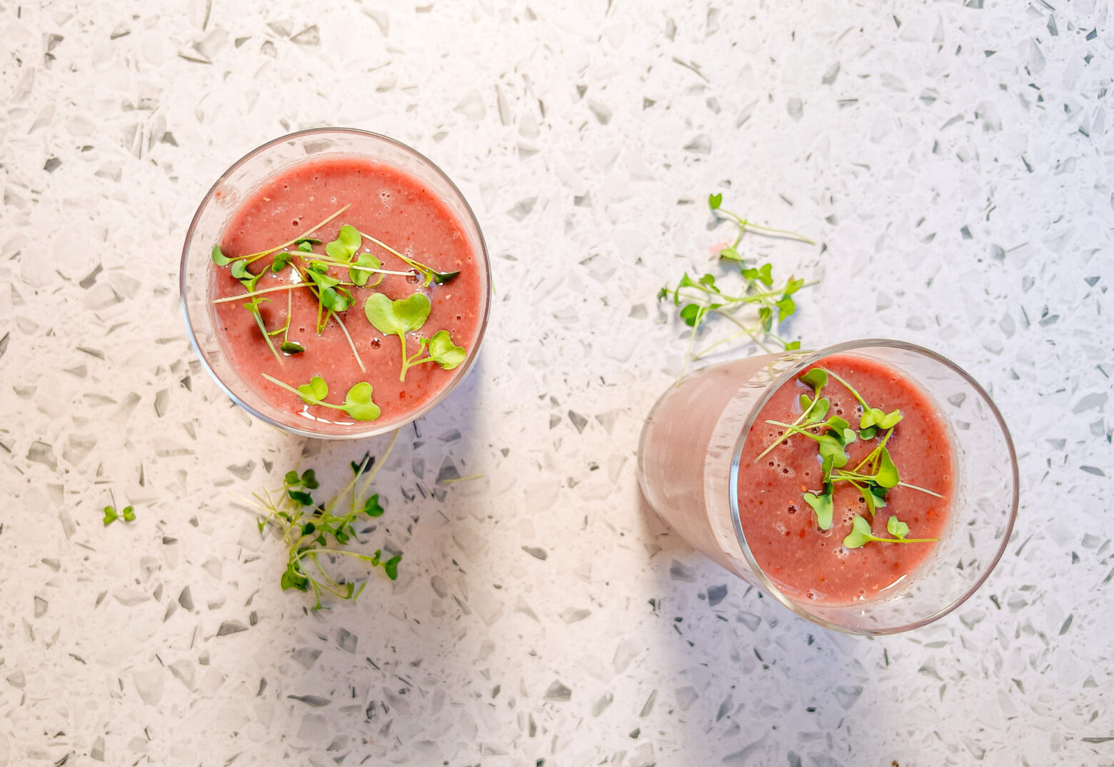 Berry Broccoli Smoothie overhead with microgreens on top.