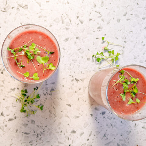 Berry Broccoli Smoothie overhead with microgreens on top.