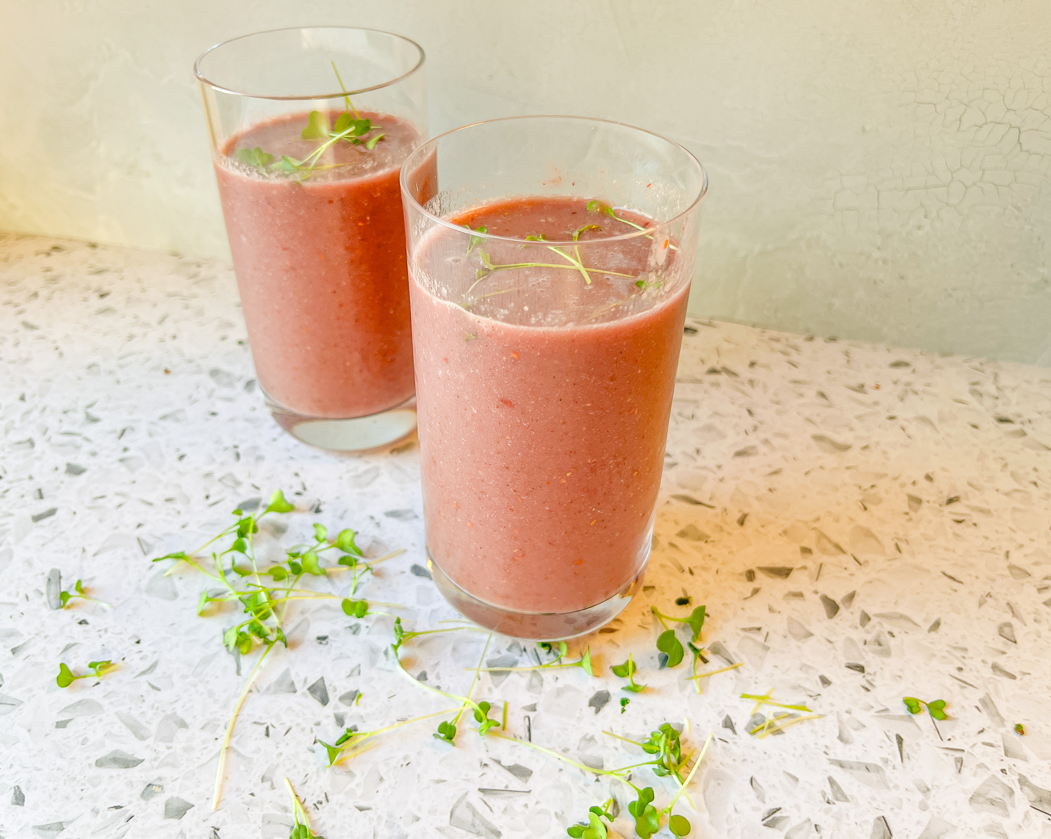 Berry Broccoli Smoothie finished with microgreens onto.