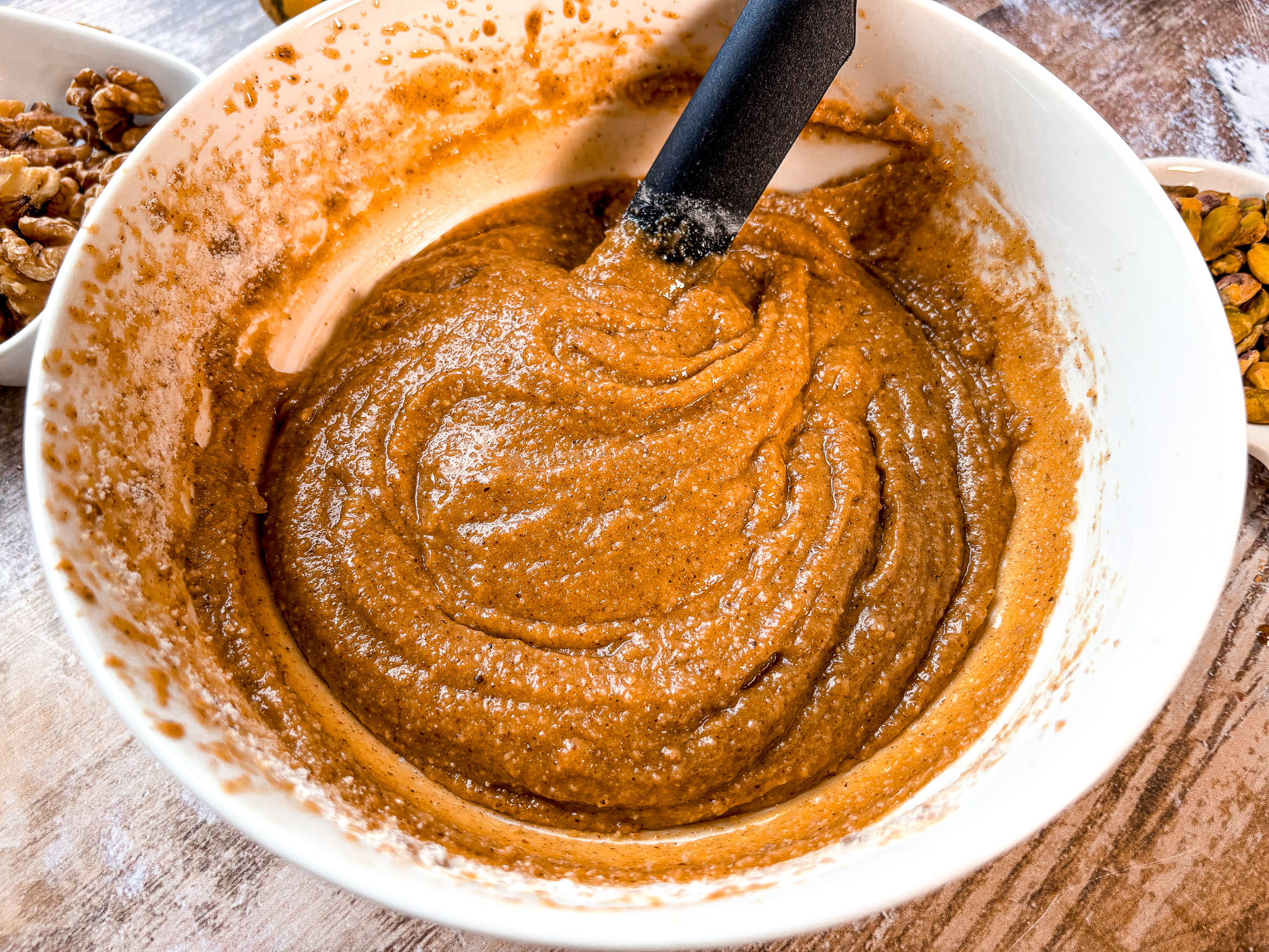 Nutty cookie batter being stirred. 