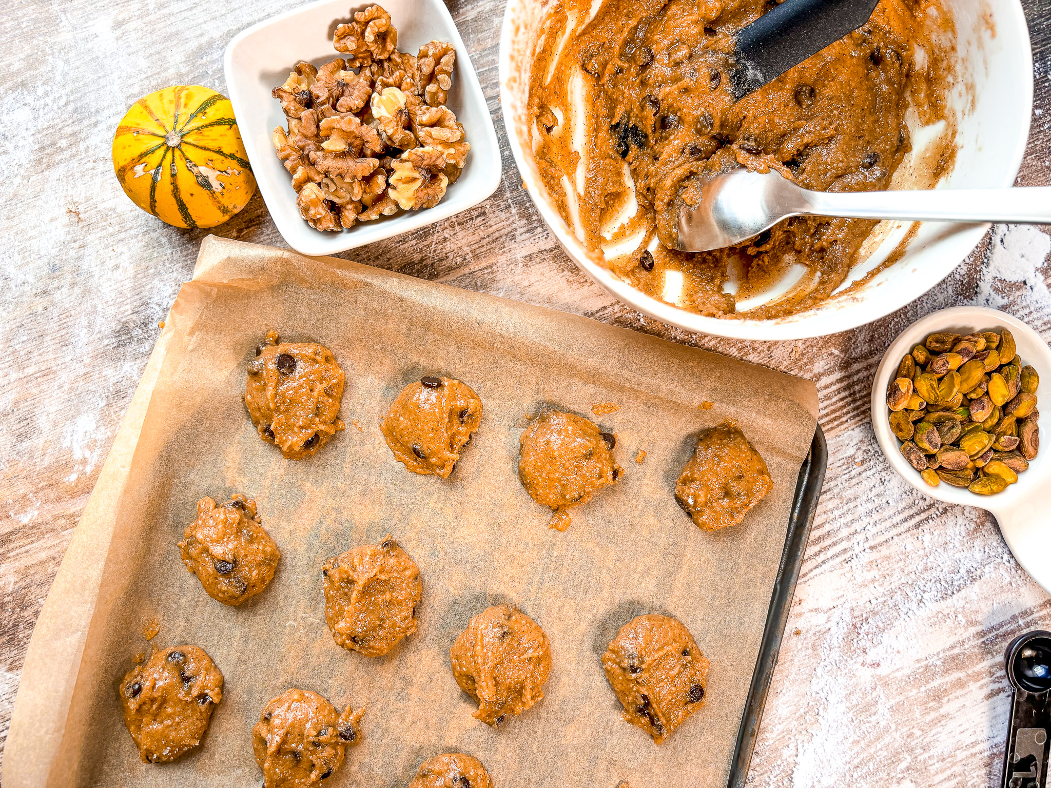 Nutty cookies on a baking sheet pre-bake.