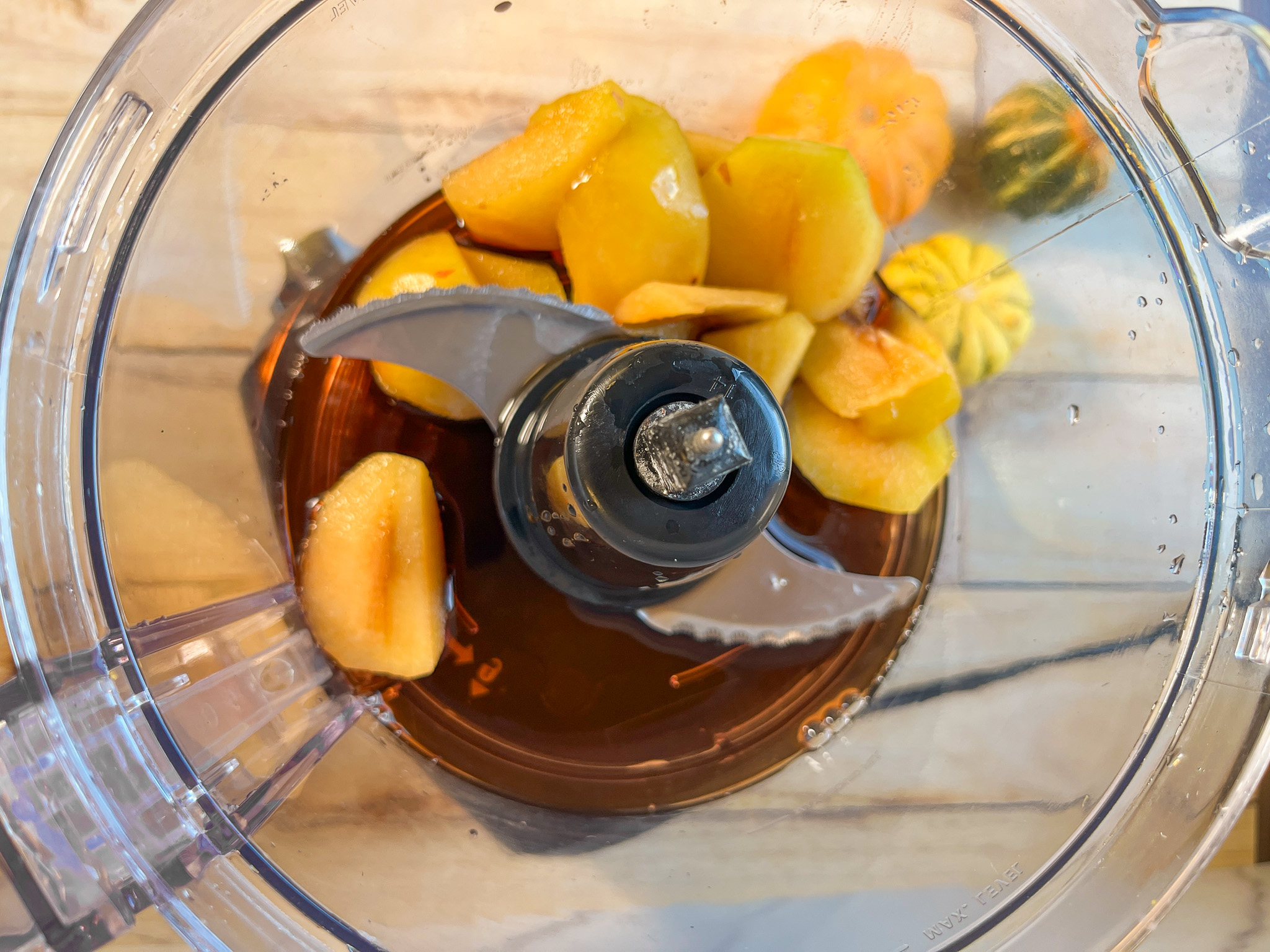 Plums and pomegranate juice in a food processor.