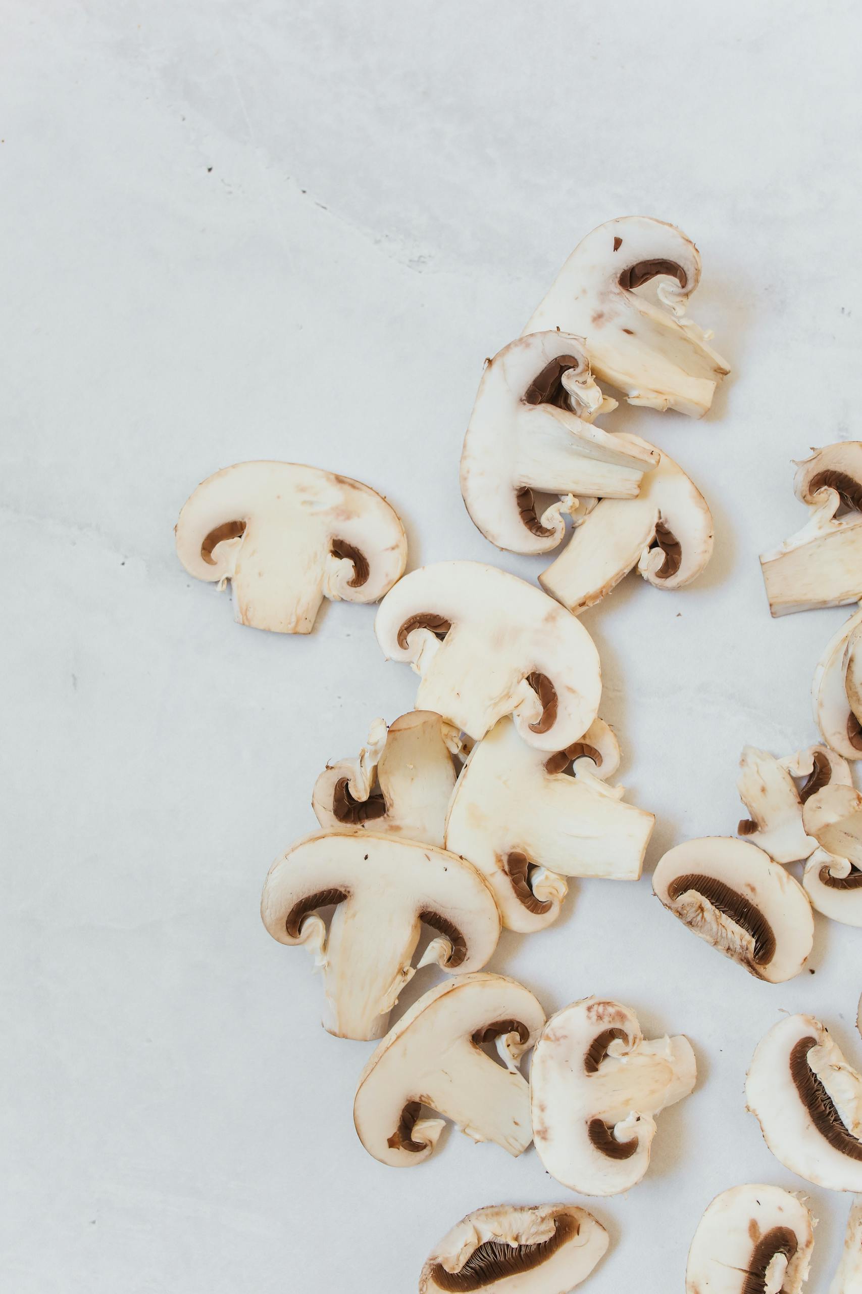 Slices of white button mushrooms.