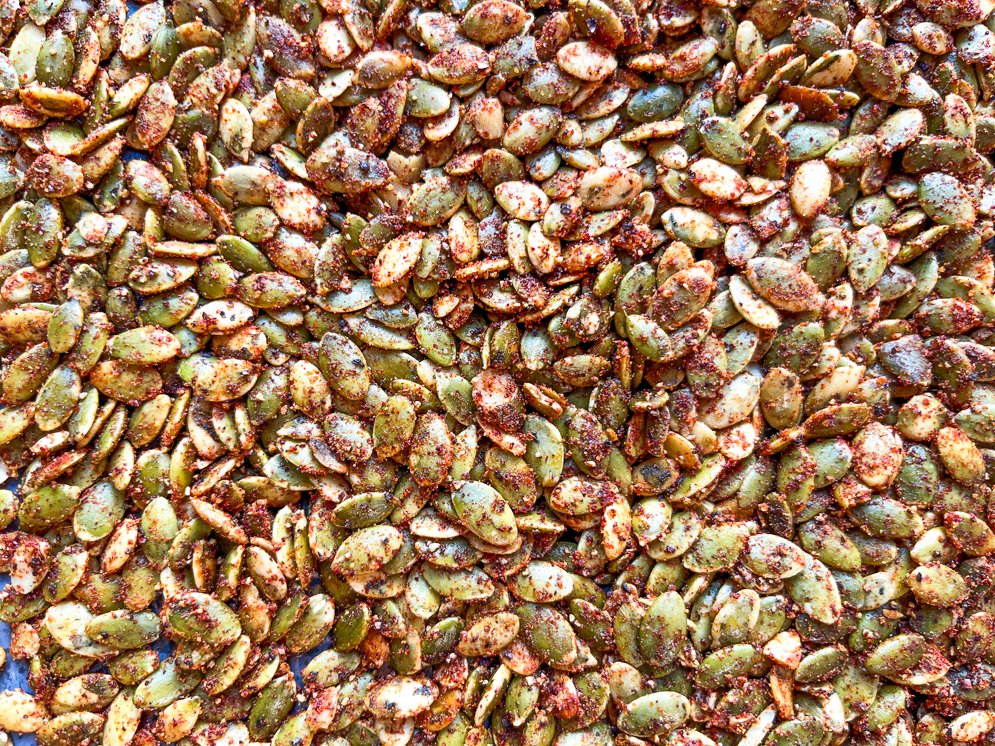 Spiced pumpkin seeds close up.