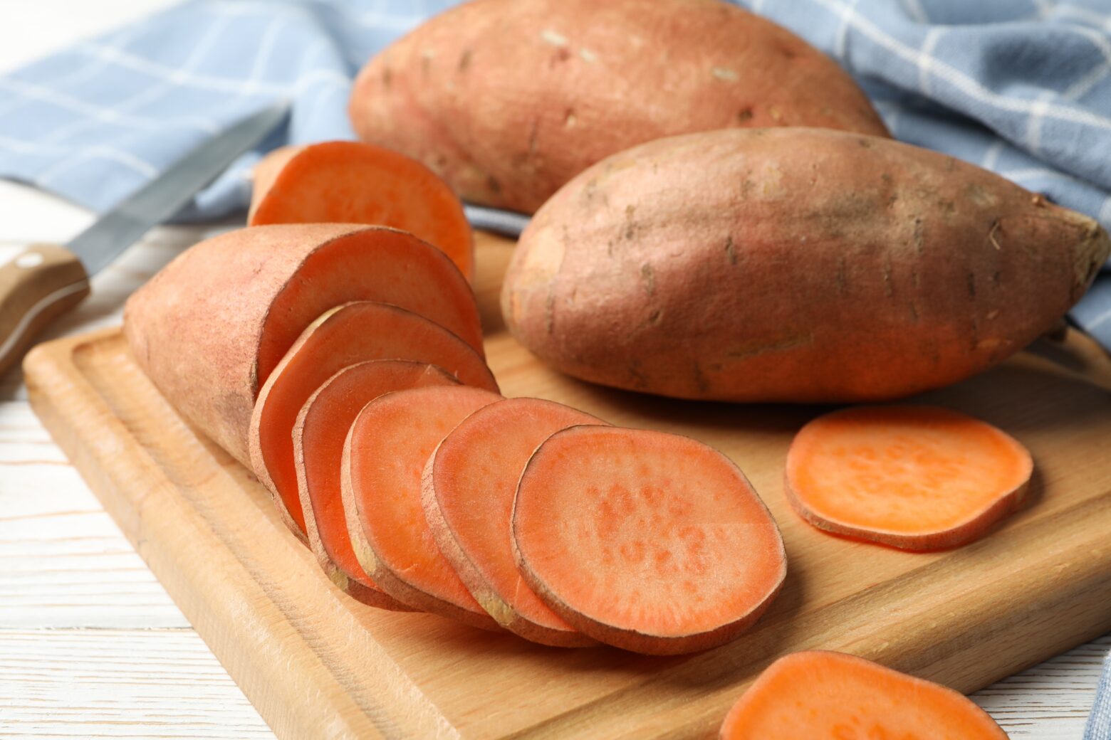 Sweet Potatoes on cutting board.