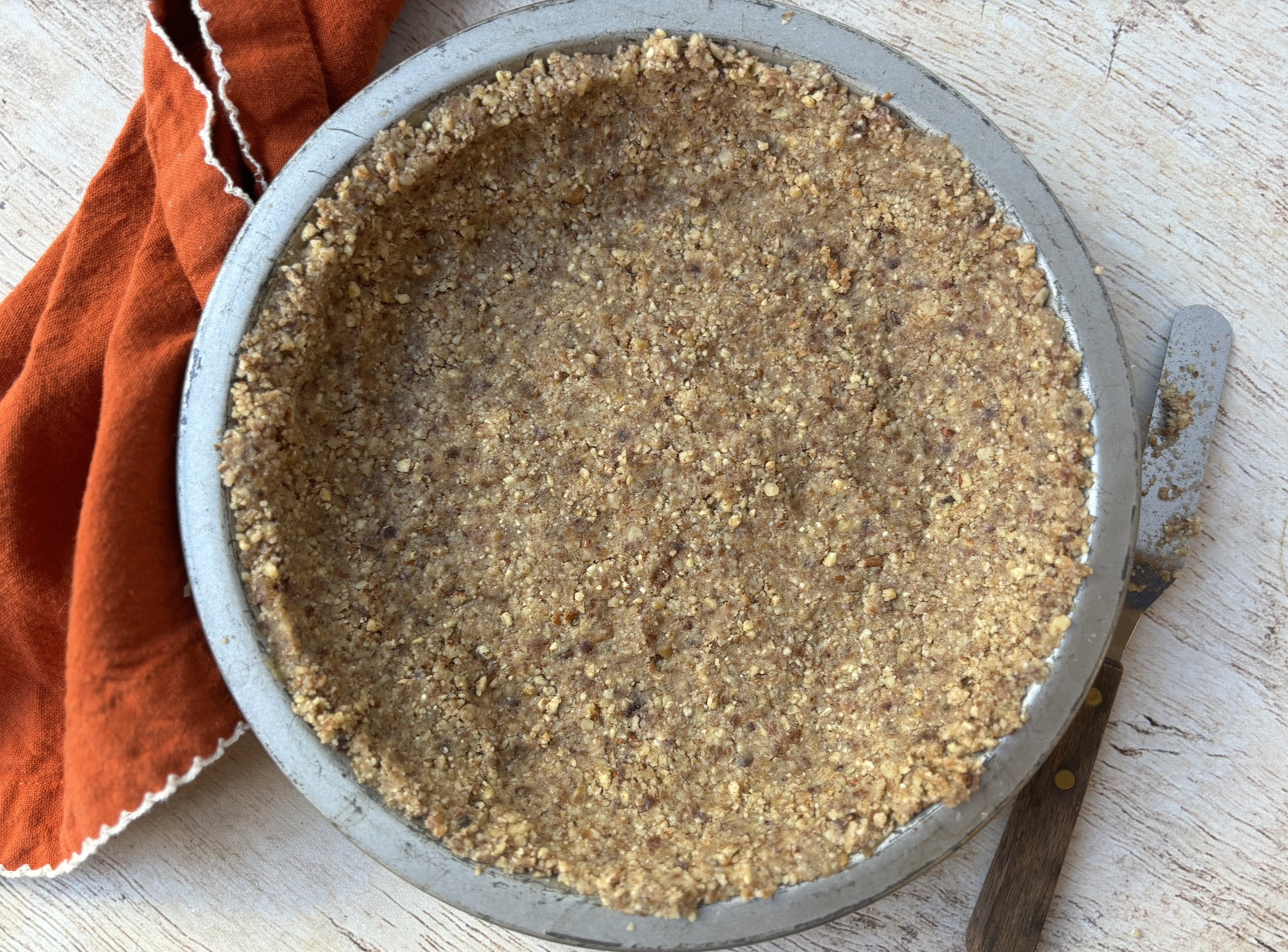 Sweet potato pie crust in a mold.