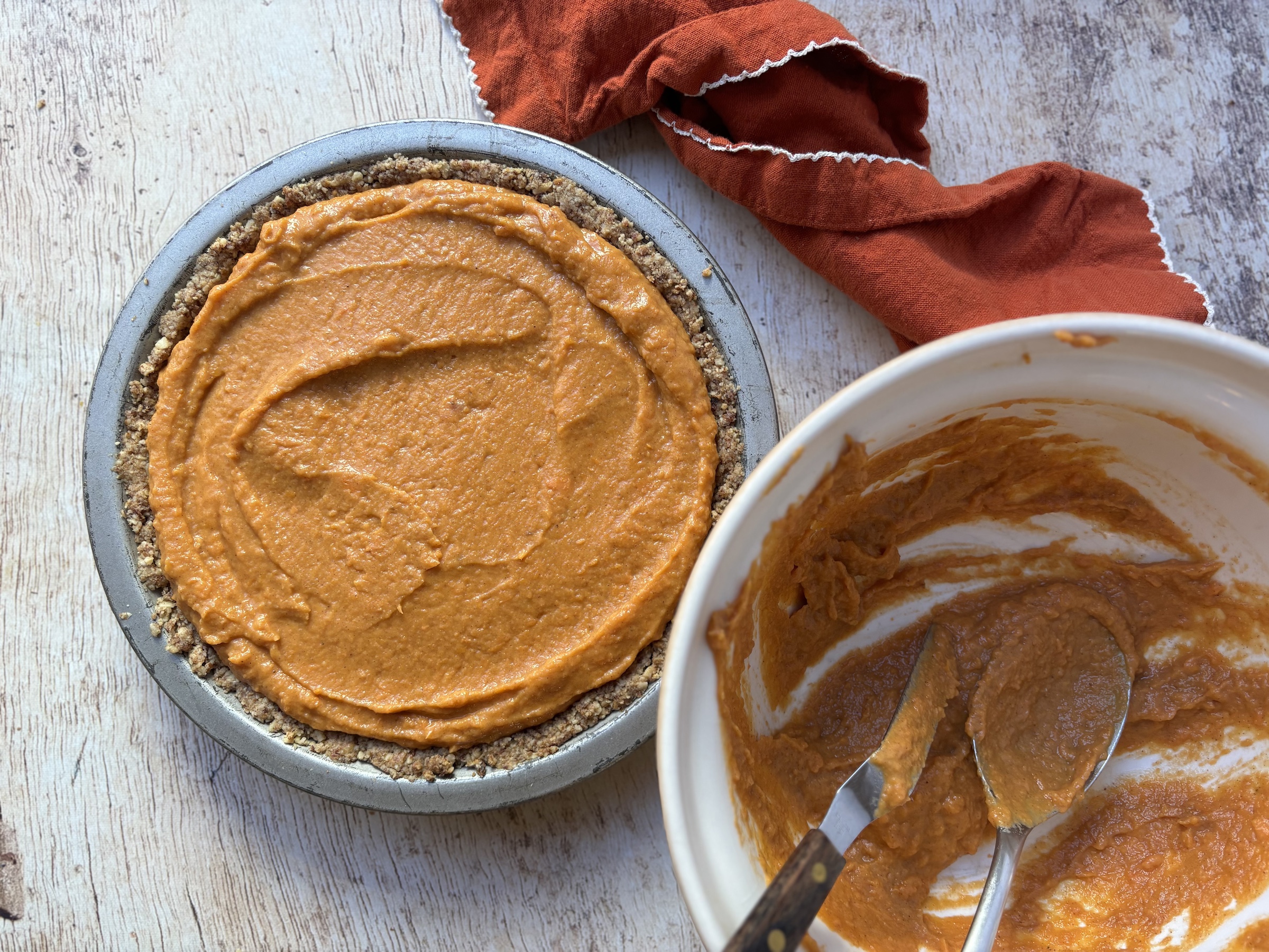 Sweet potato pie adding the filing.