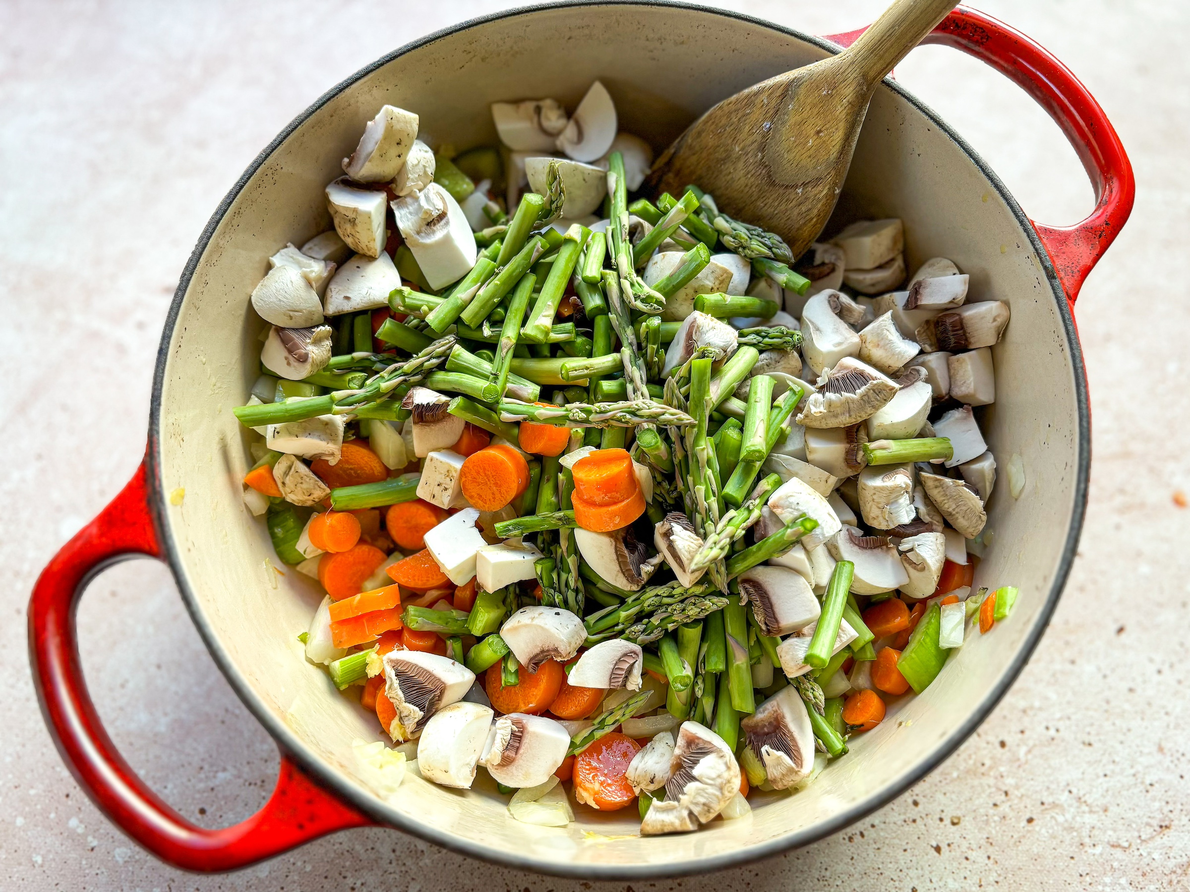 Chicken Pot Pie Casserole being prepped in a pan. 