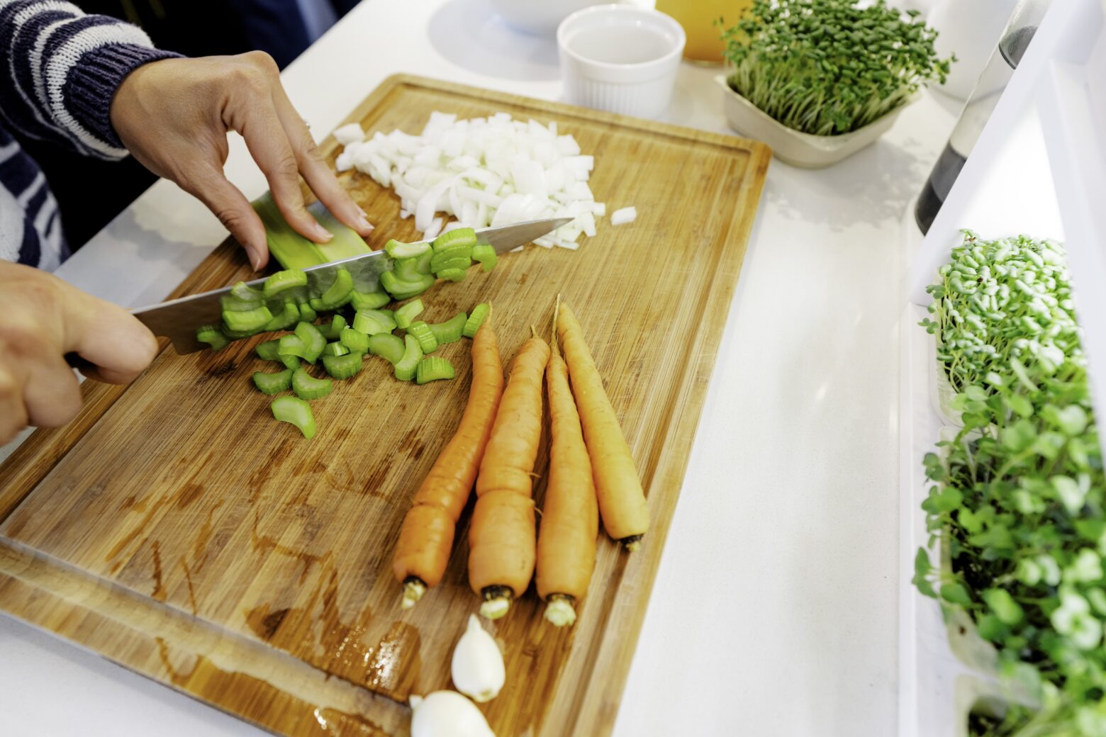 Vegetables being chopped for mustard chicken soup recipe.