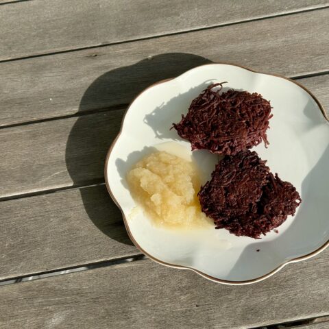 Okinawa latkes finsihed on a table outside.