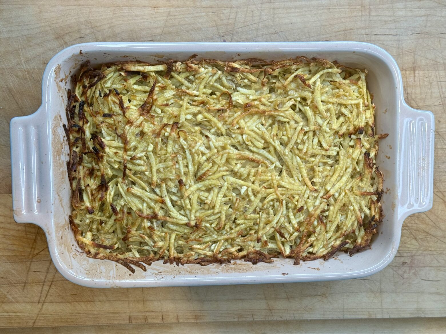 Sweet potato kugel finished in a baking dish.