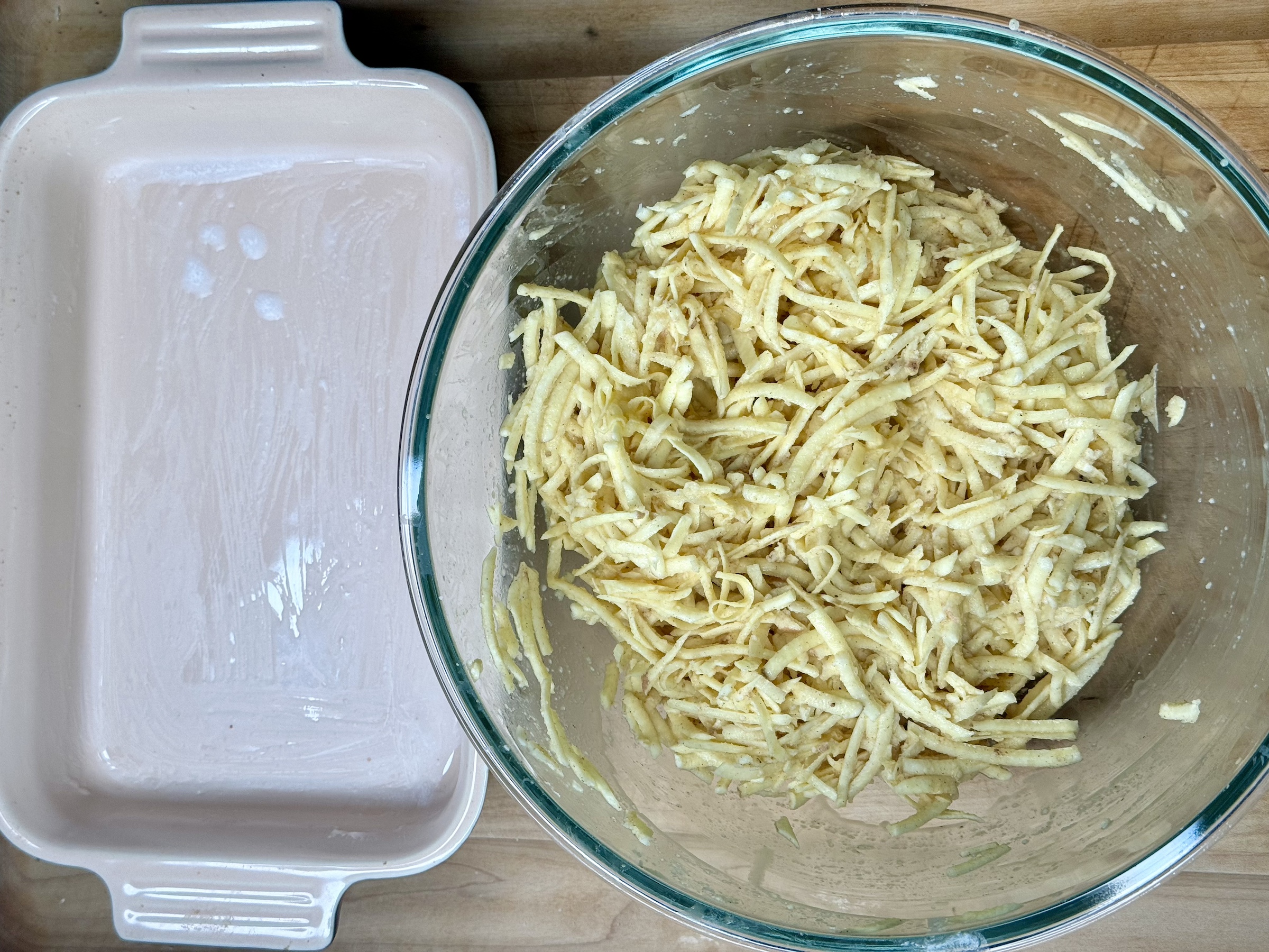 Sweet potato kugel prep in a mixing bowl. 