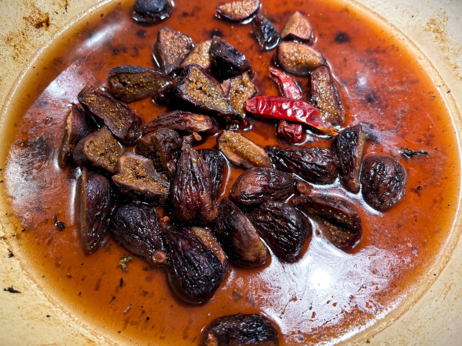 Beef and broccoli with the sauce in a pan.