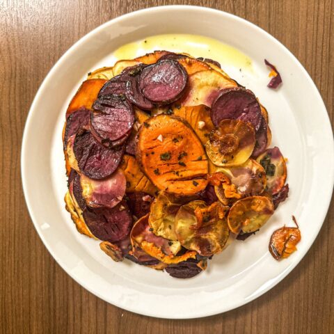 Sweet potato pommes anna plated in a dish.