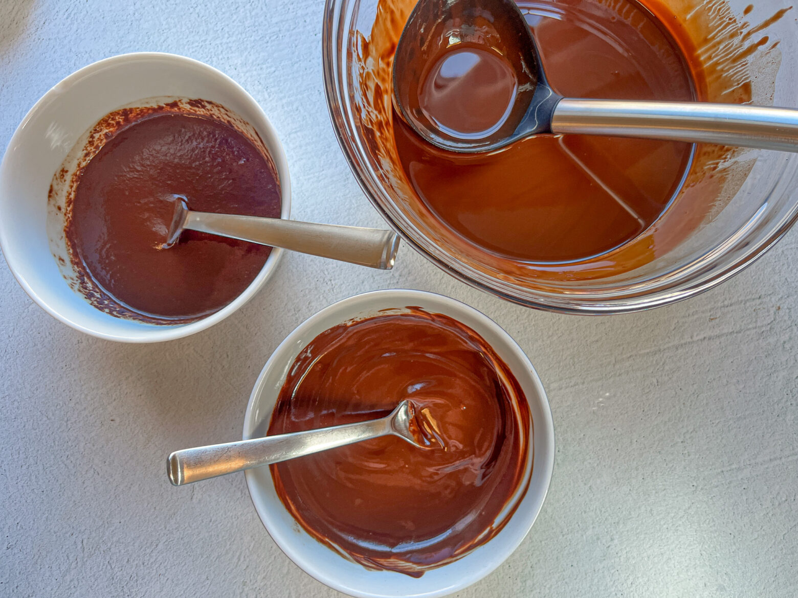 Chocolate-covered strawberry cacao being prepped in bowls. 