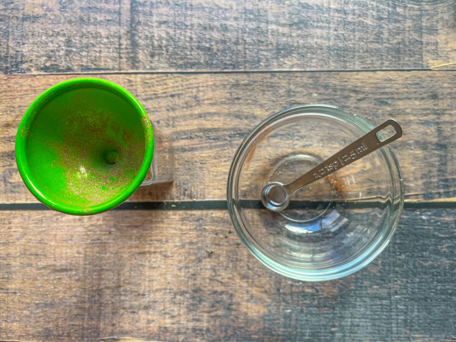 Cajun seasoning funneled into the jar.