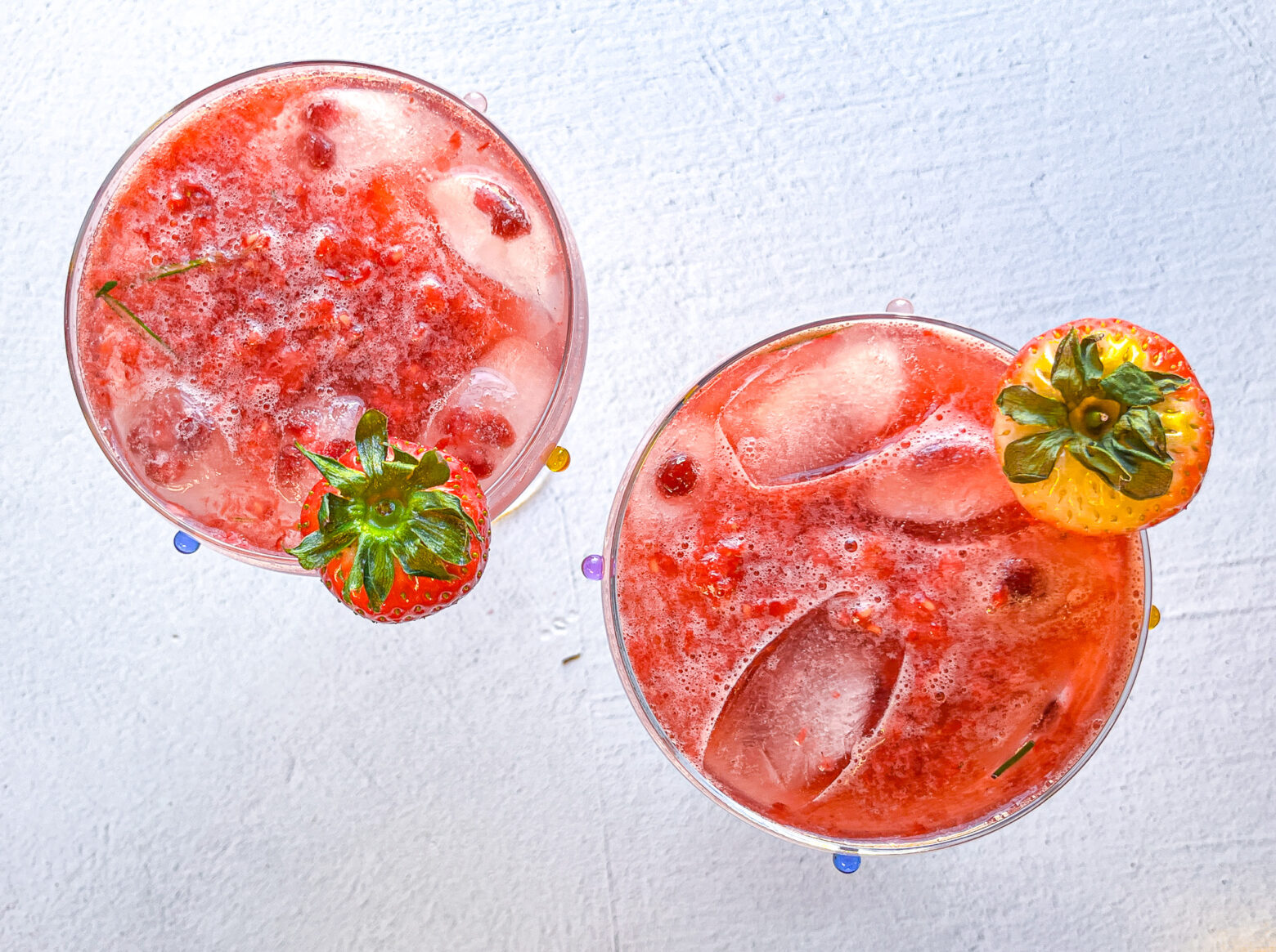 Strawberry sour mocktails overhead shot in martini glasses.