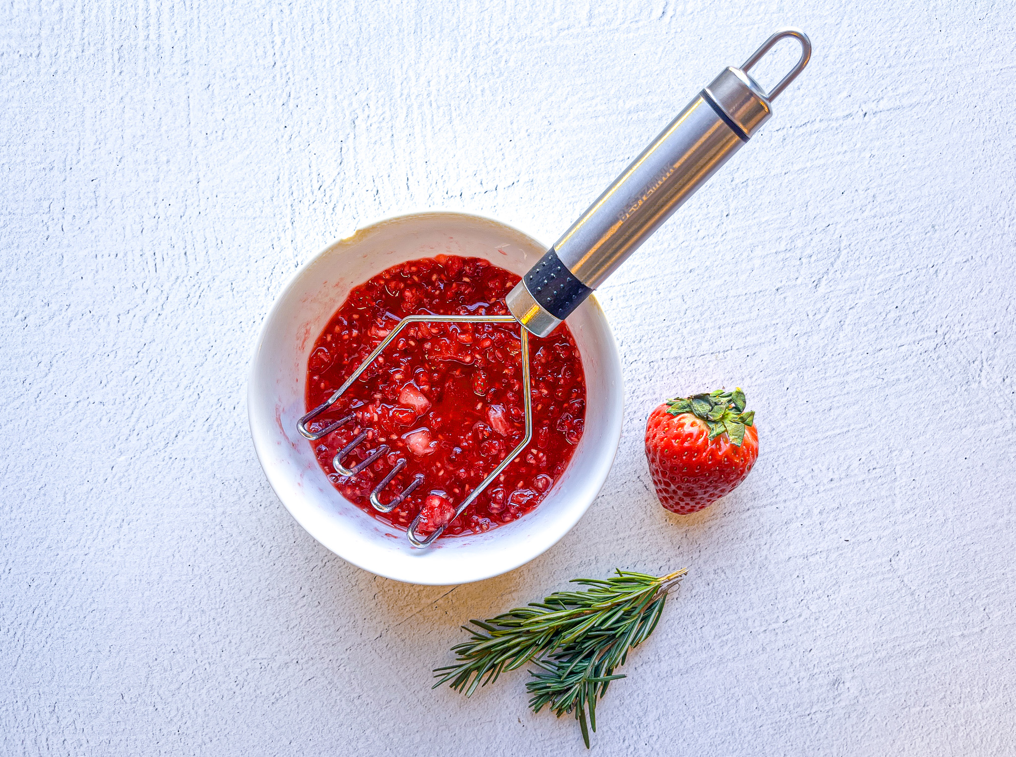 Strawberry sour mocktail prepping the puree. 