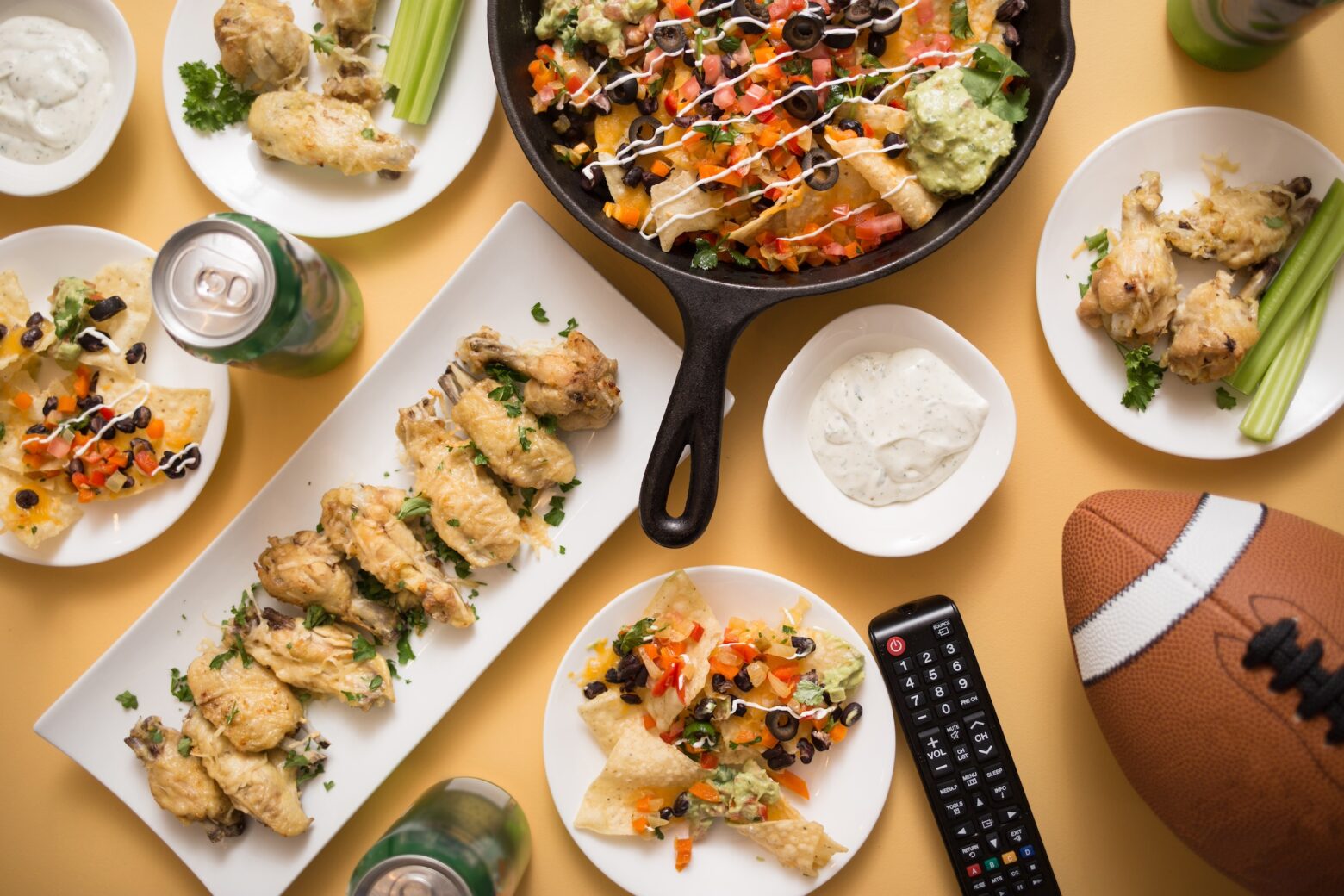 Super Bowl Sunday snacks, small bites, and appetizers on a table with a spread.