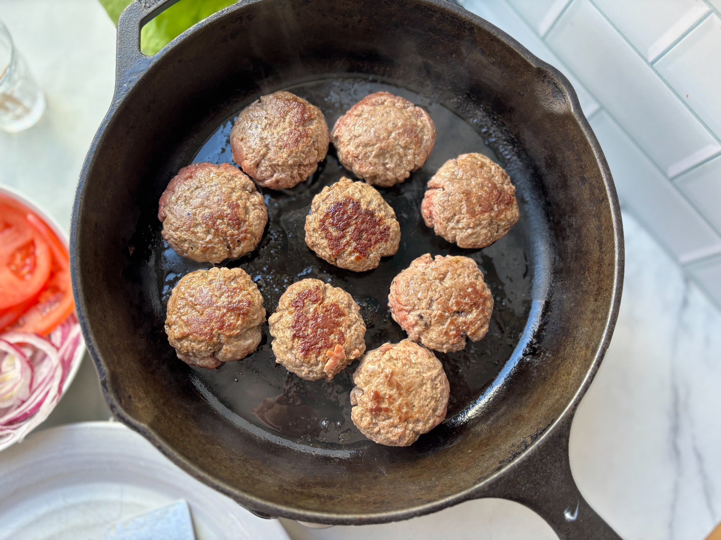 Cooking ground beef for bunless sliders in a cast iron. 