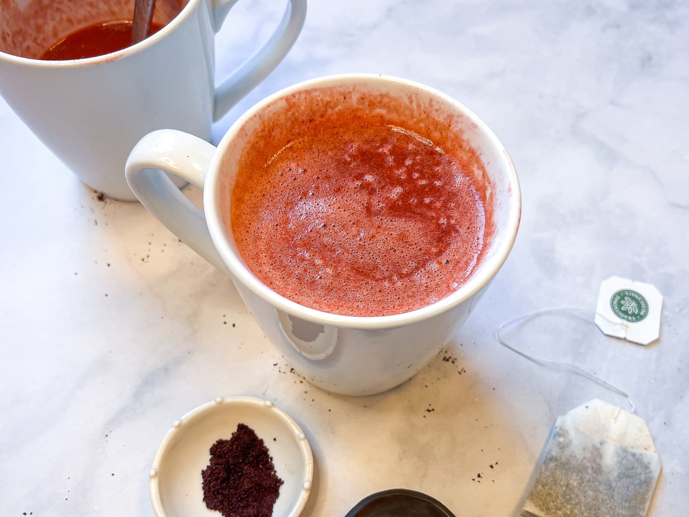 Elderberry citrus elixir mug close-up shot, finished. 