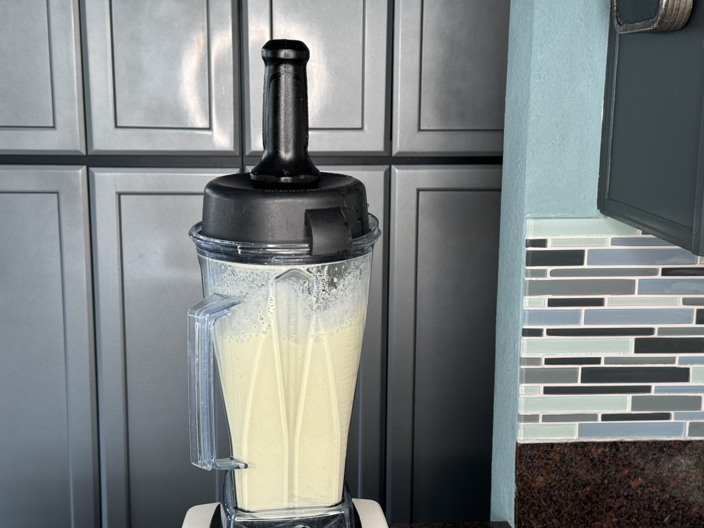 Pistachio milk being blended in the blender. 