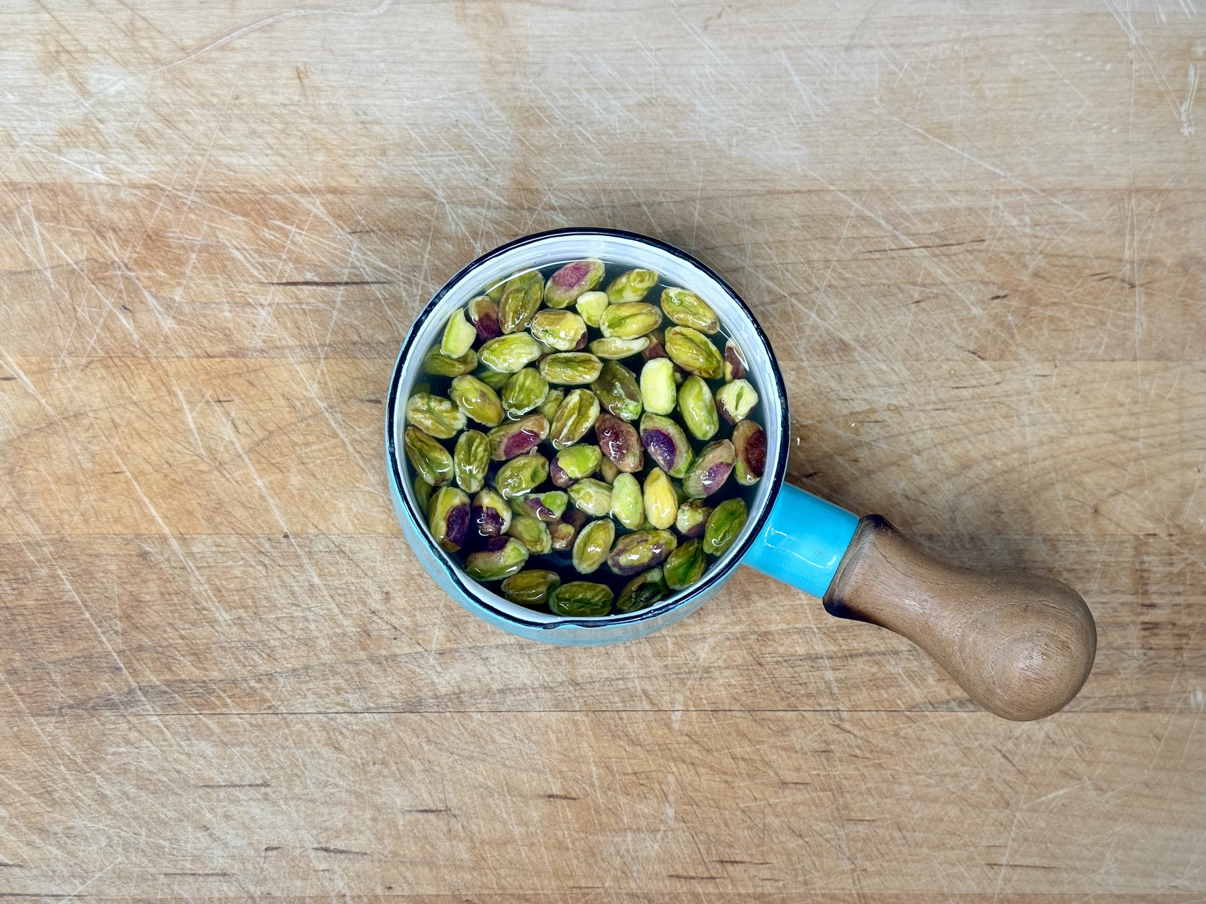 Pistachios soaking in water. 