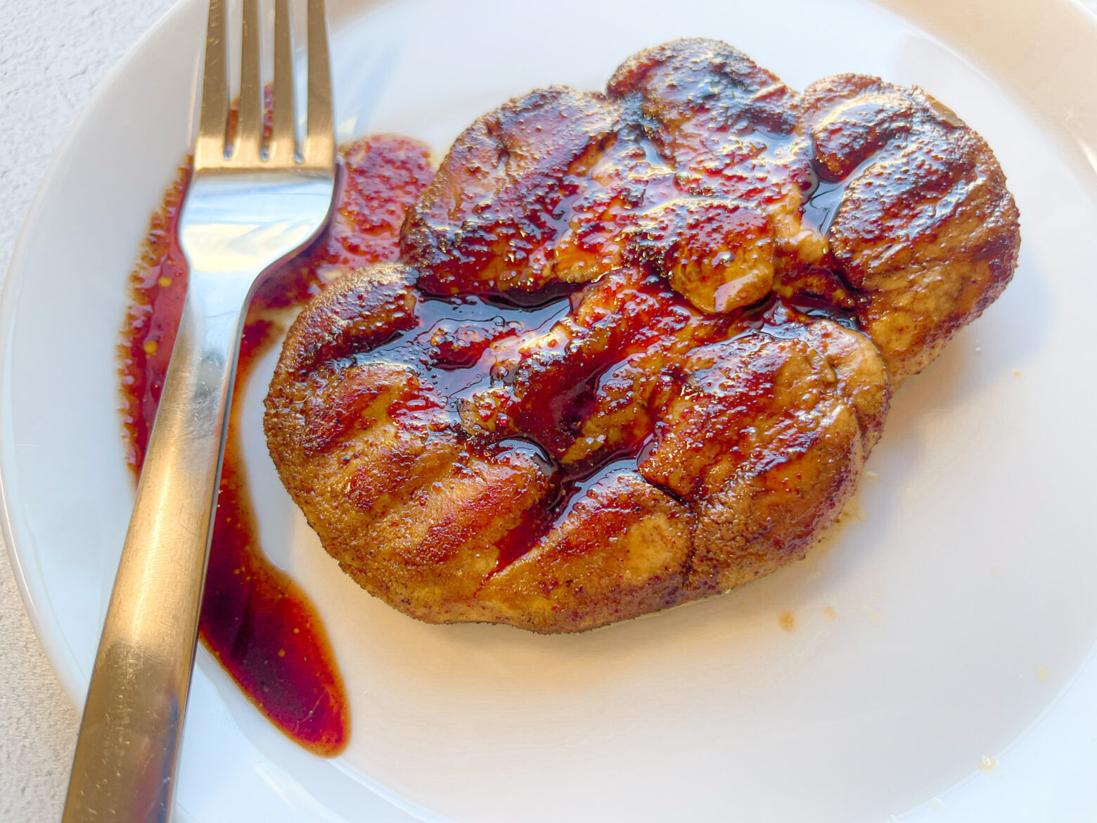 Fully cooked Lion's Mane Steak on a plate