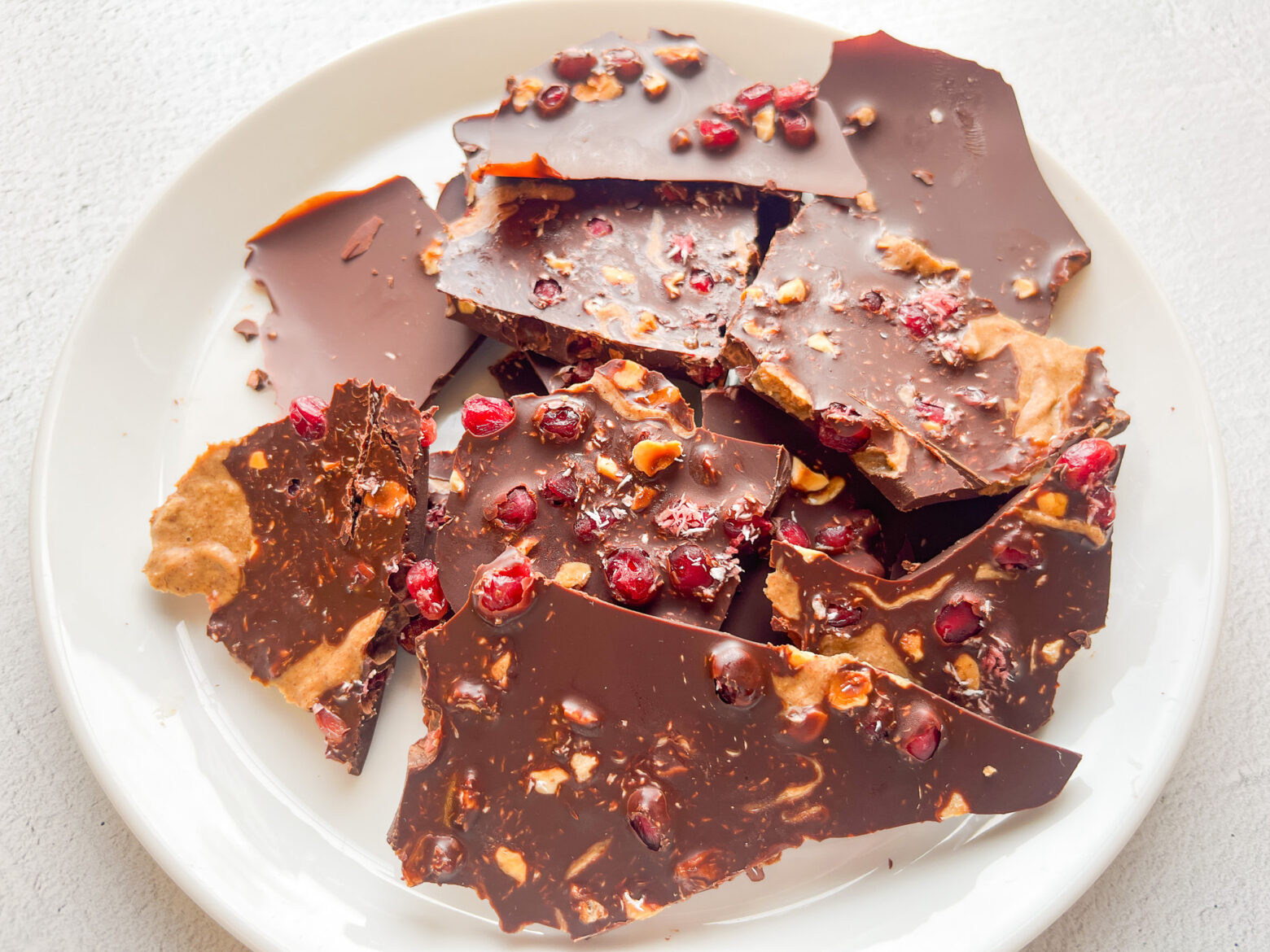 Pomegranate Chocolate Bark on a plate, finished.