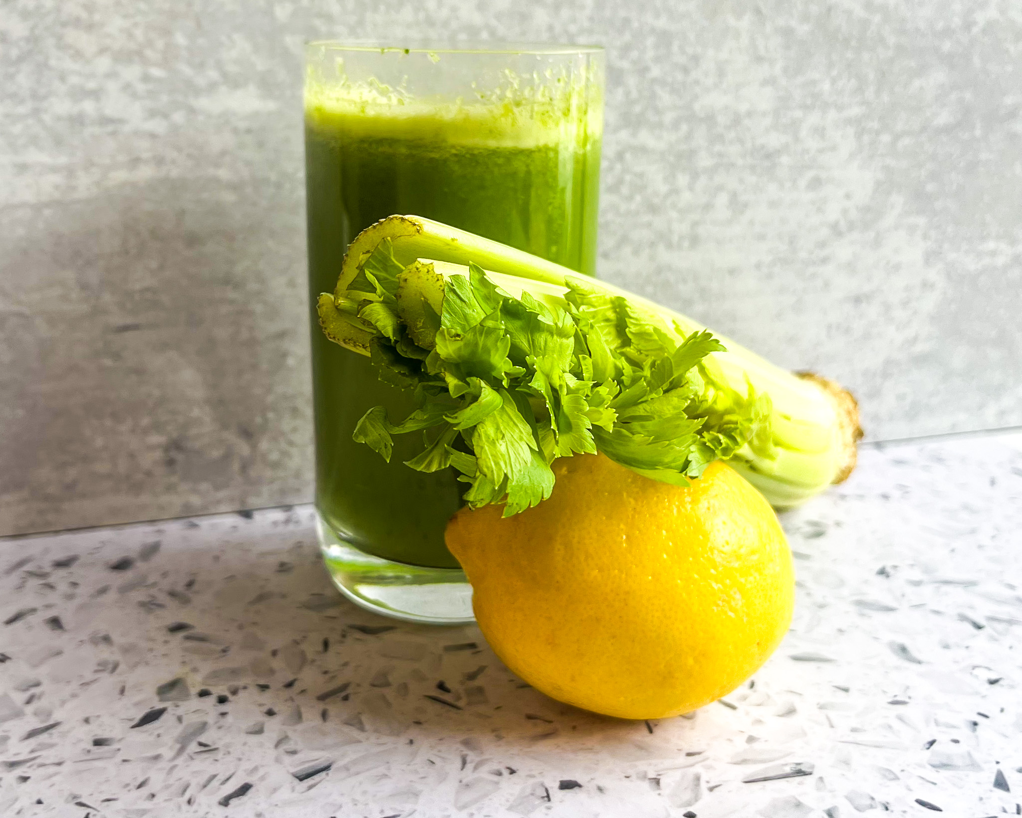 Tropical green juice finished with celery and a lemon. 