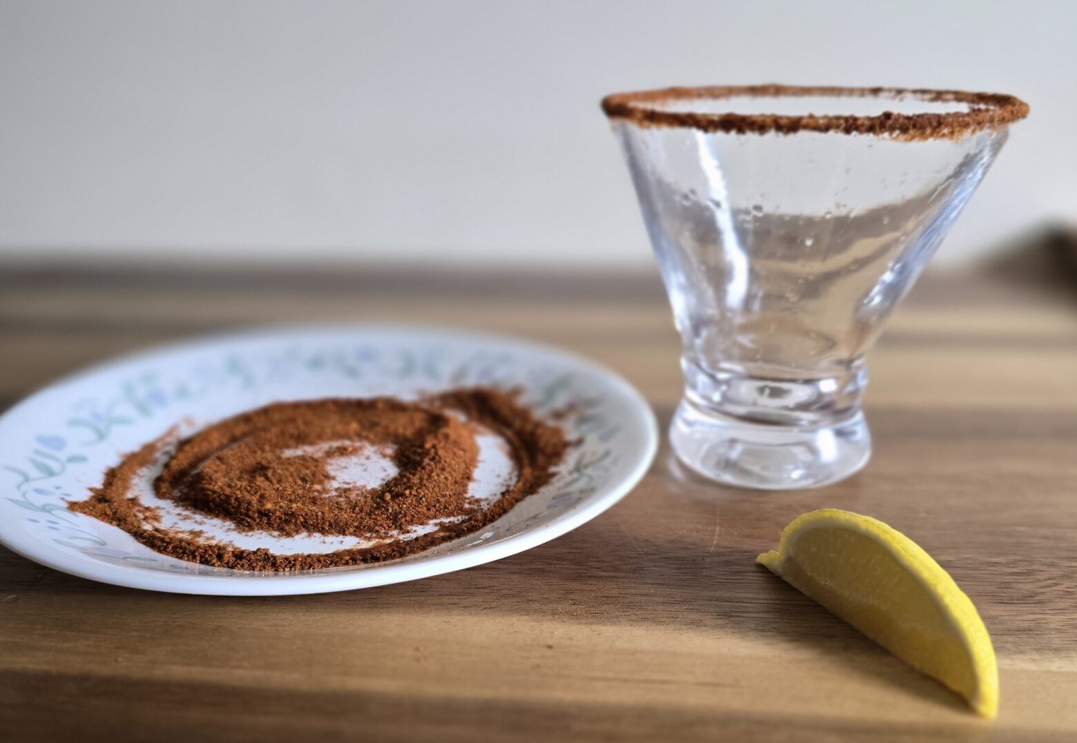 Prepping the rim of the glasses for the bloody mary mocktails.