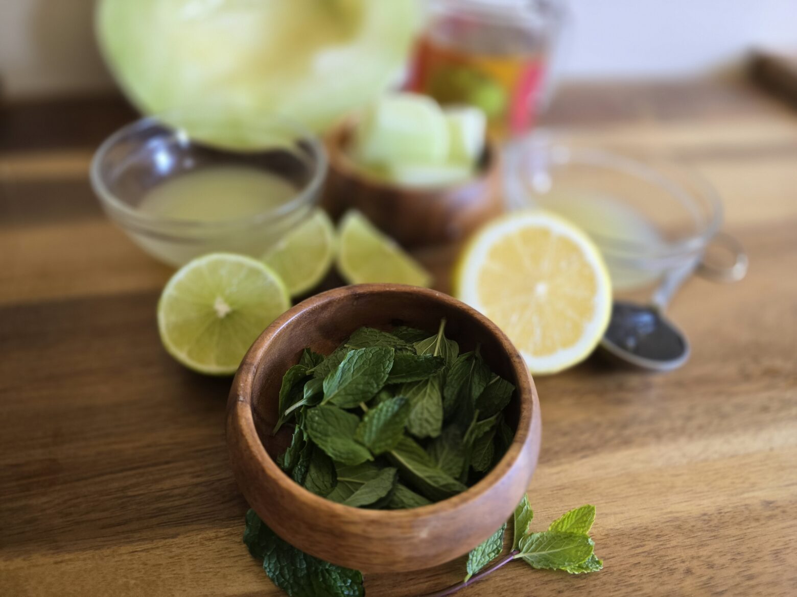 Leprechaun mint lemonade ingredient prep on a cutting board.