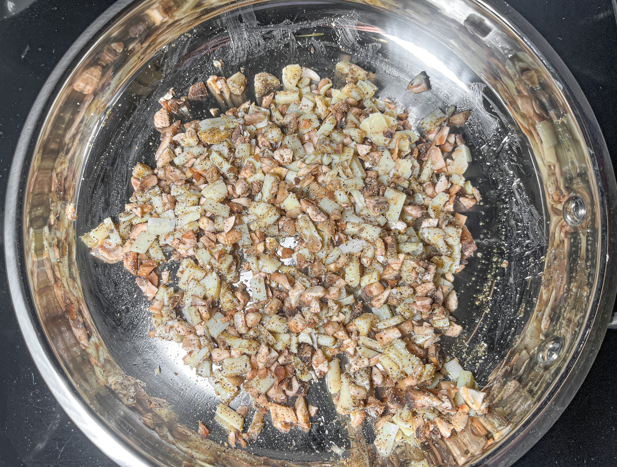 Mushroom rice prepped in a pan.