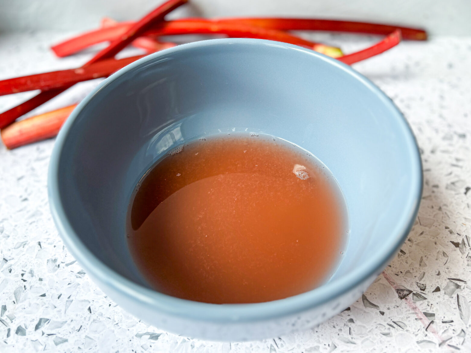 Rhubarb Sour Mocktail liquid in a bowl