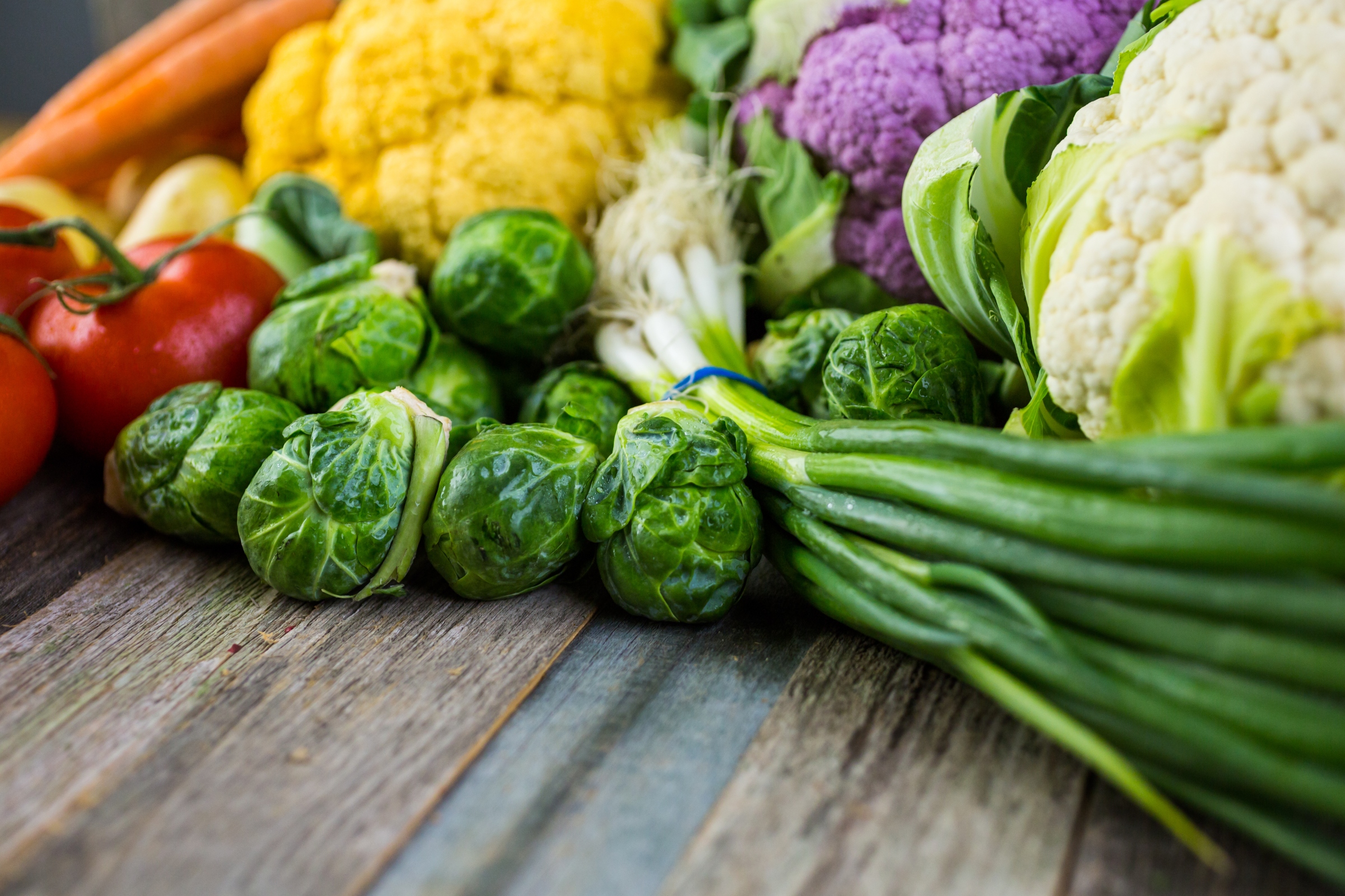 Close-up of several high-fiber foods on a wooden table