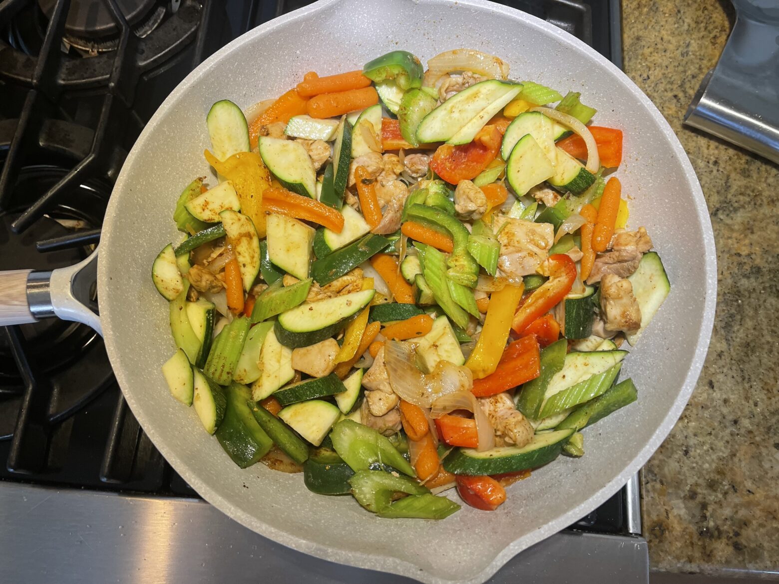 Kitchen sink stir fry prep on stove.