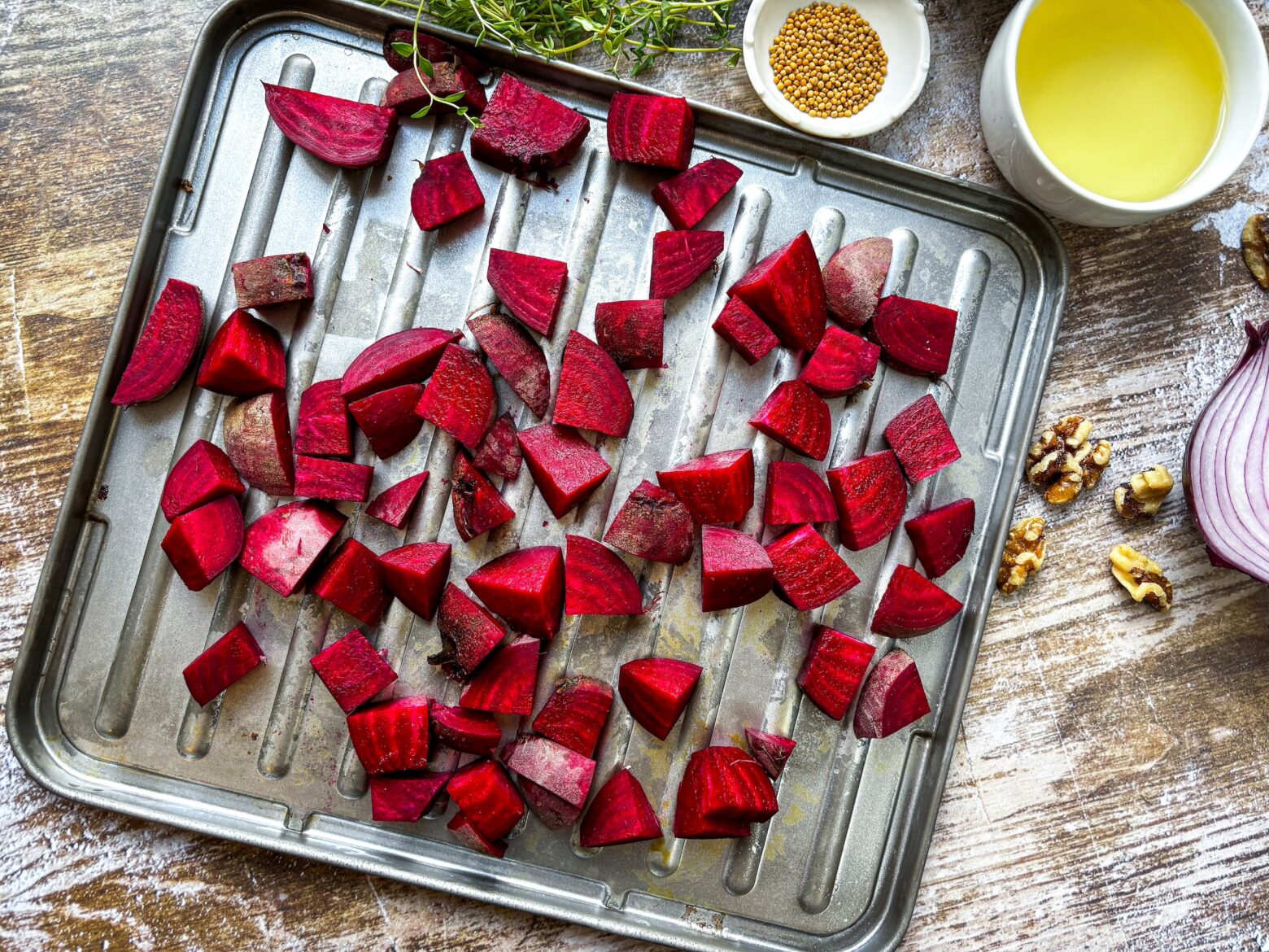 Lavender salad beet prep on a baking sheet.
