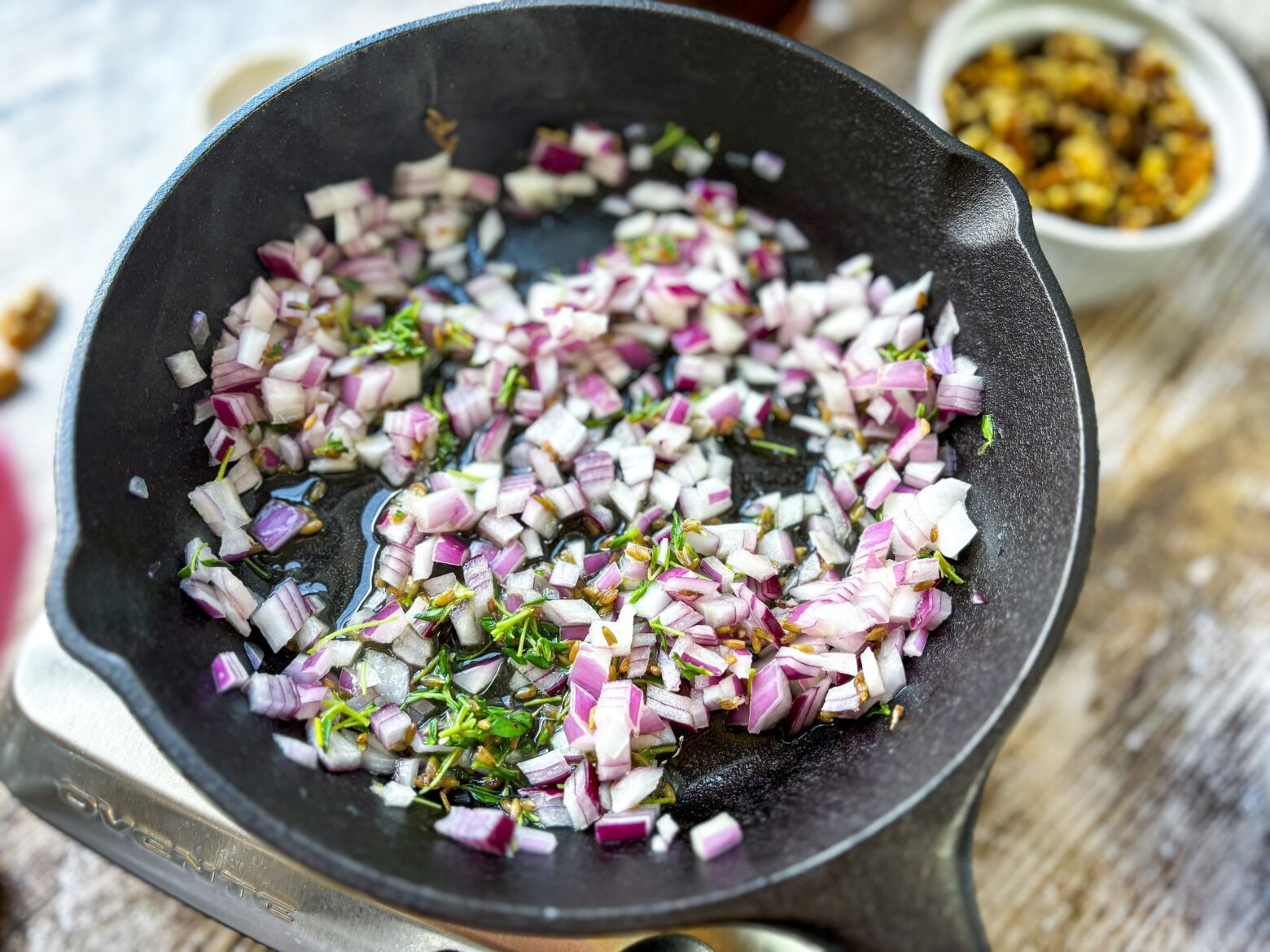 Lavender salad red onion prep in the cast iron.