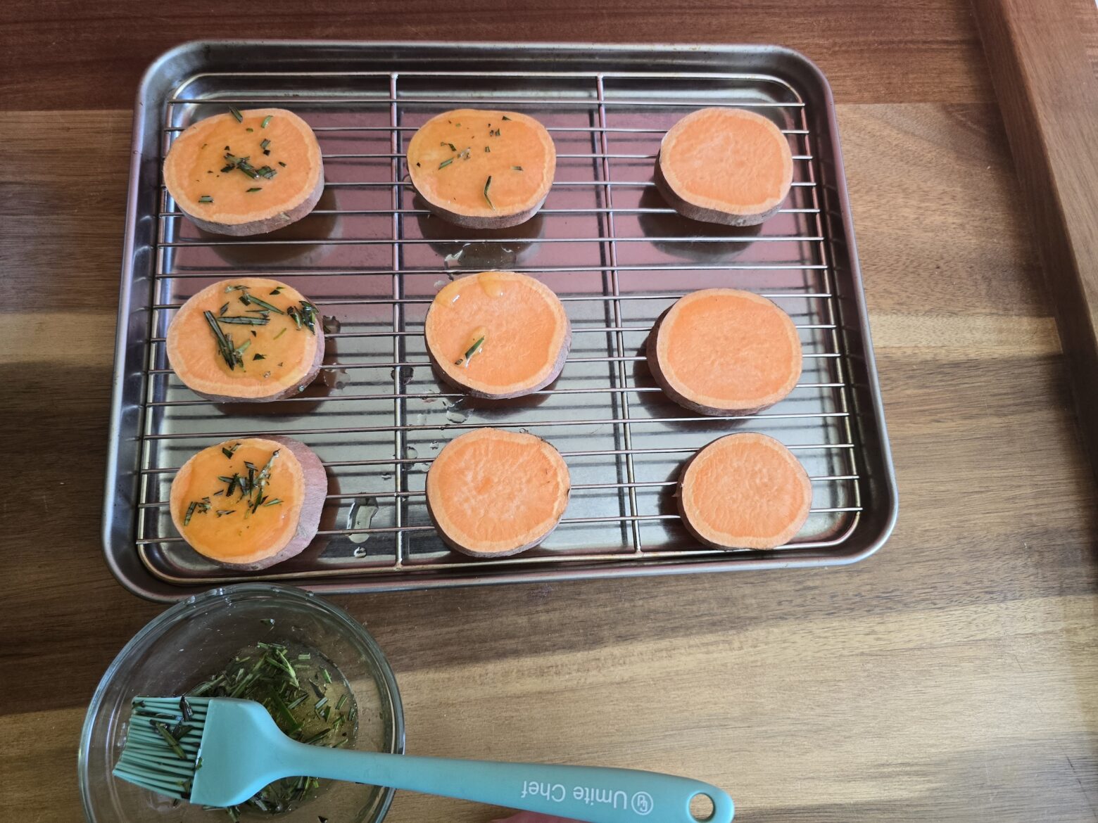 Adding olive oil to sweet potato cicles.