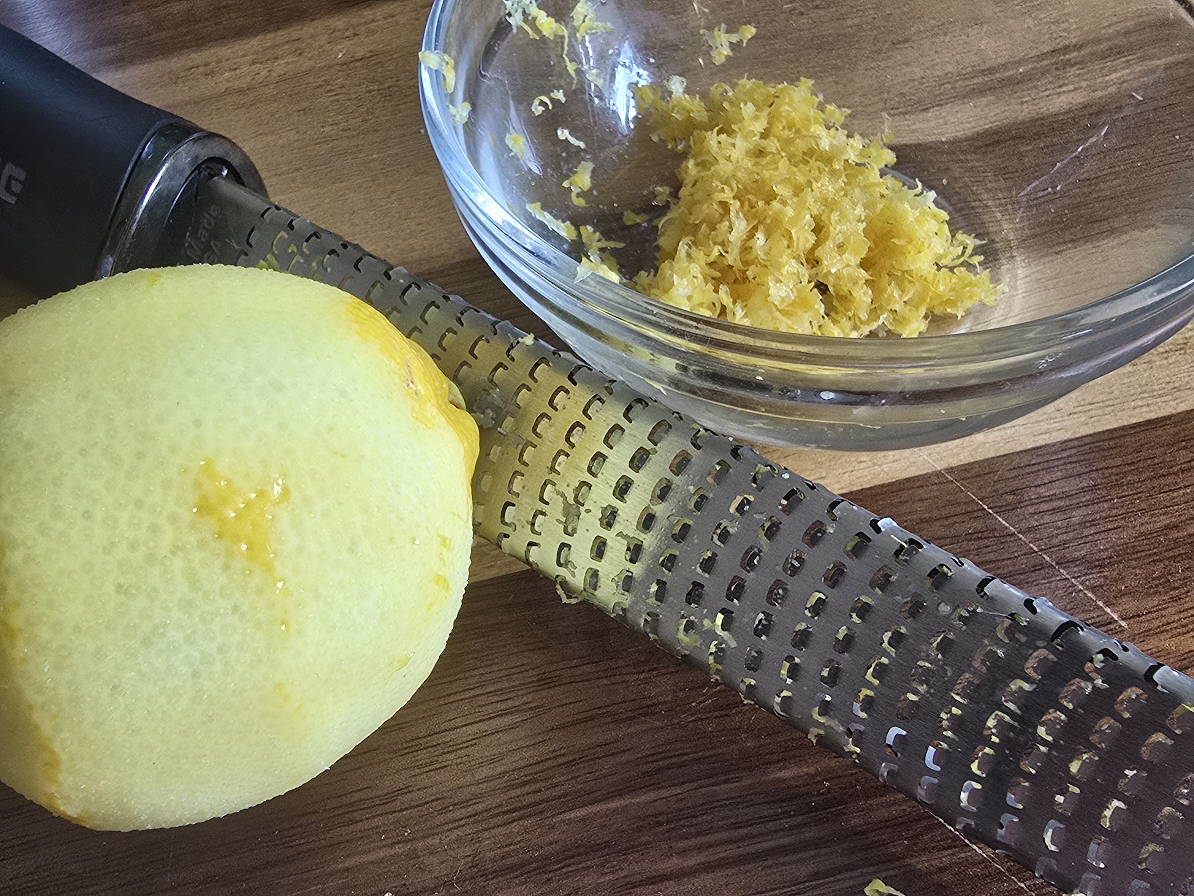 Prepping lemon zest from a whole lemon. 