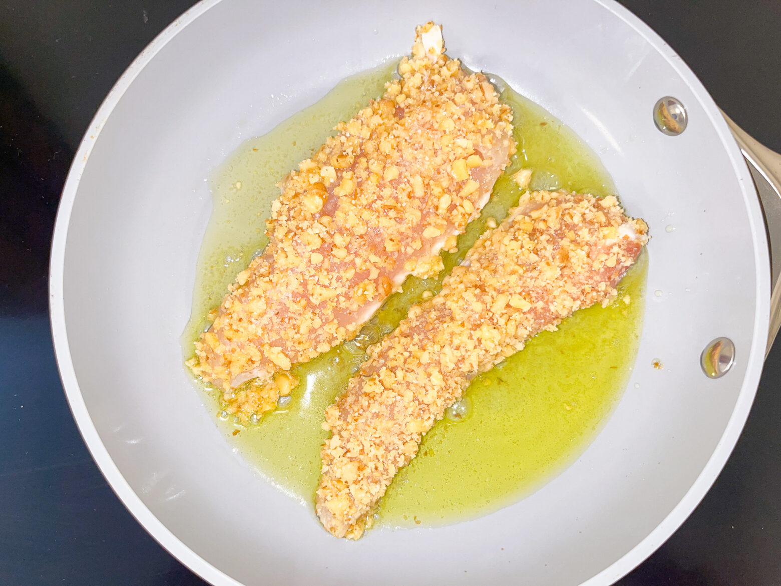 Spring mason jar salad chicken prep in a skillet.