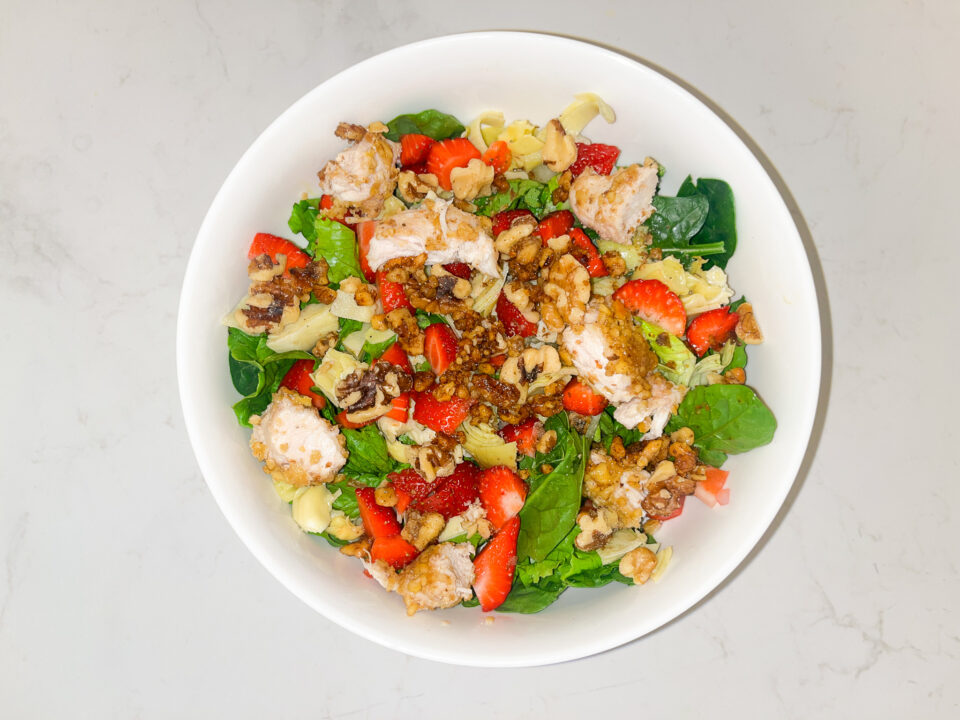Spring mason jar salad finished in a bowl.